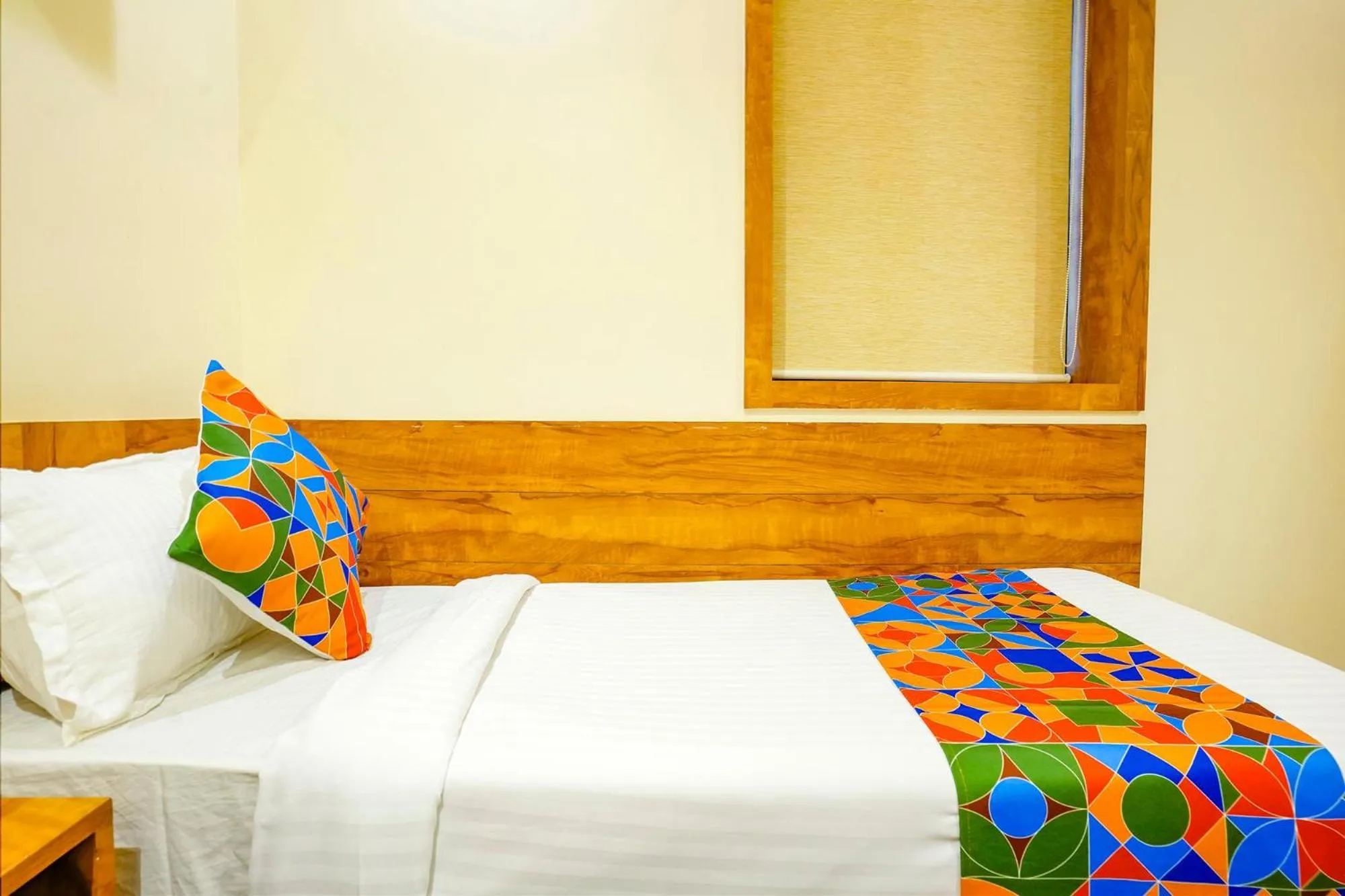 Bed in FabHotel Indore Palace