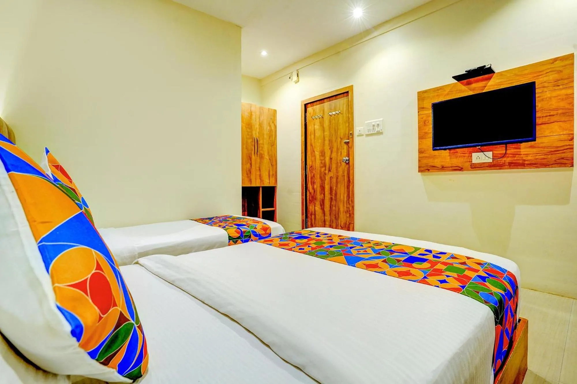 Bed in FabHotel Indore Palace