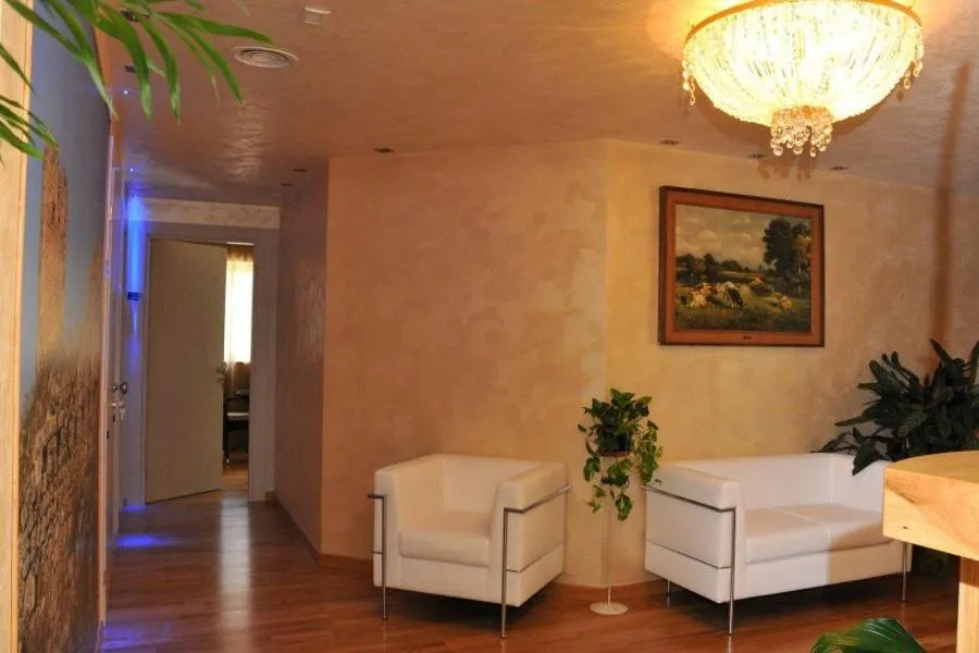 Communal lounge/ TV room in I Rocchi Hotel