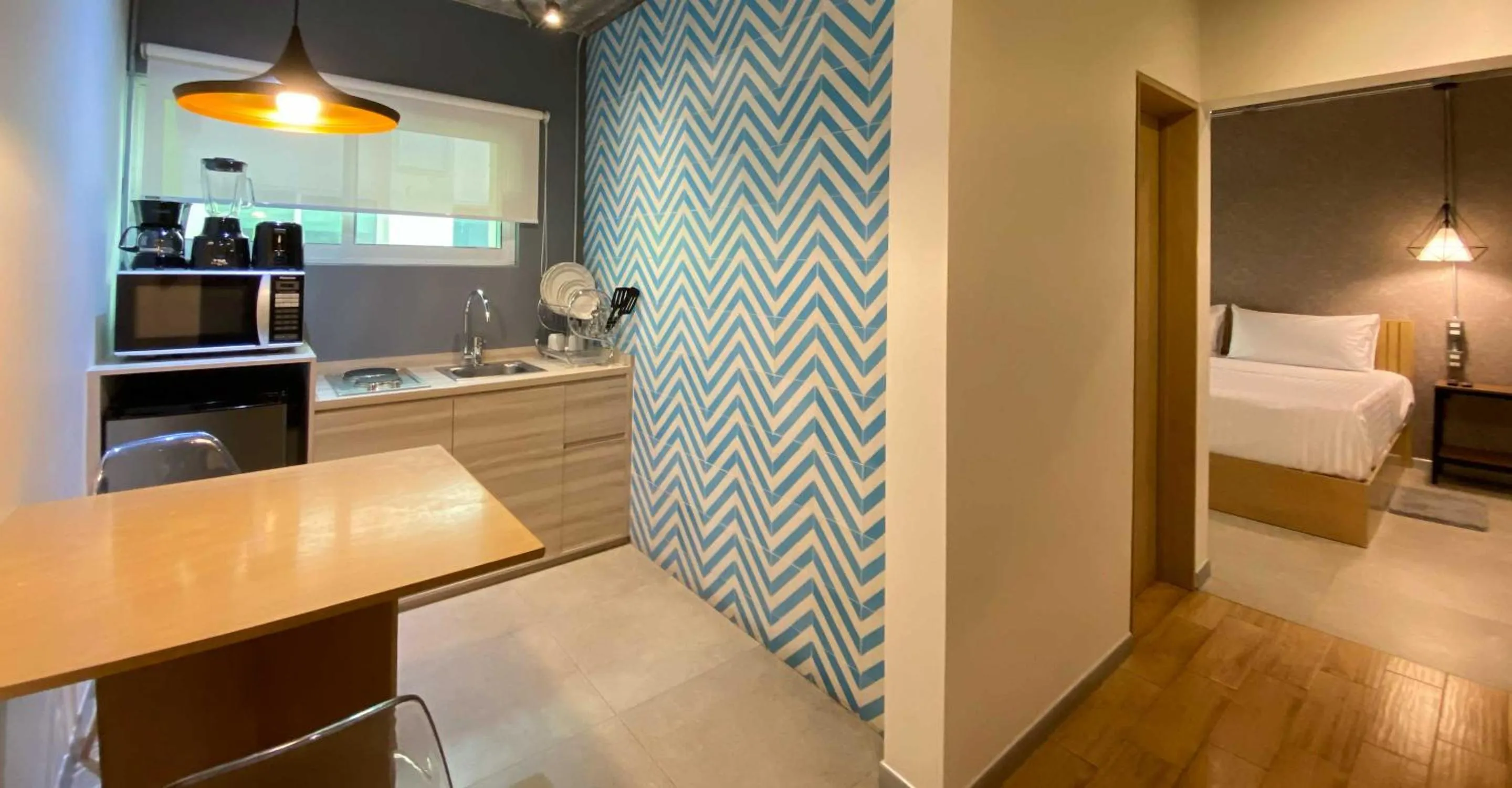 Kitchen or kitchenette, Bed in The Host Business Suites at WTC