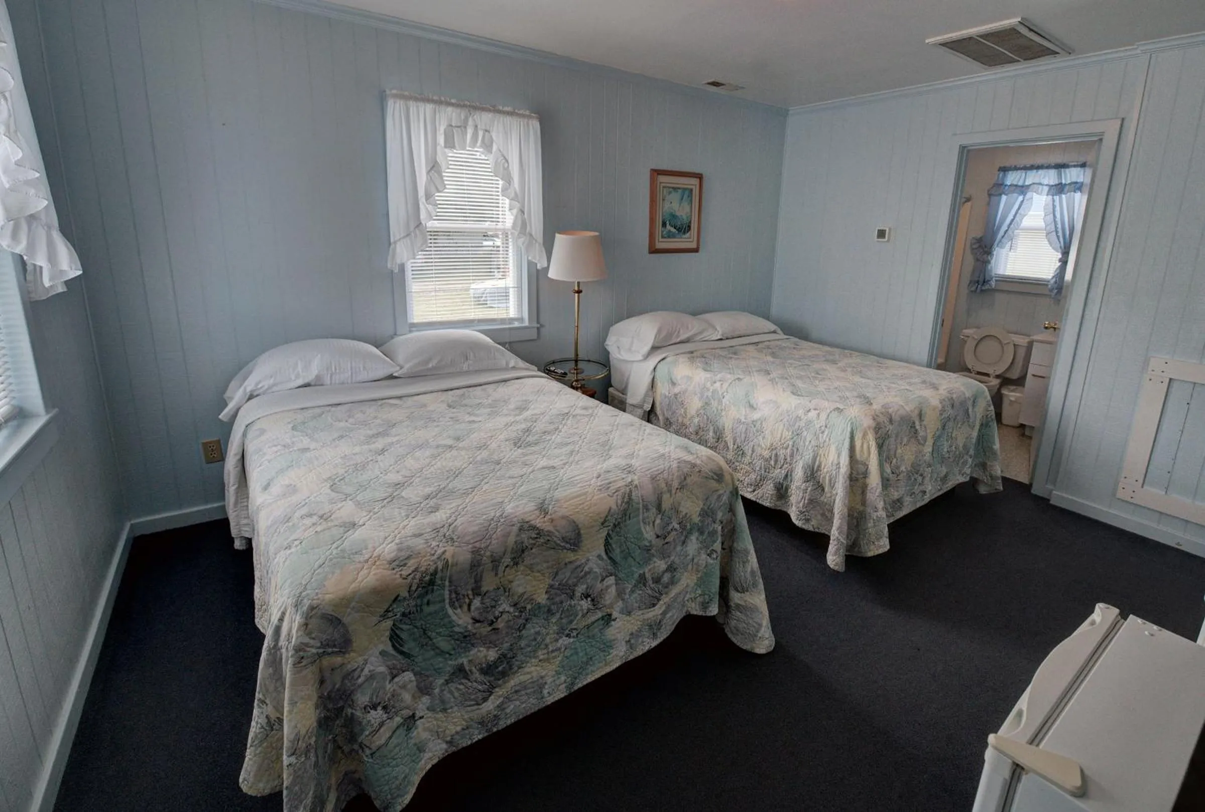 Bed in Outer Banks Motel - Village Accommodations