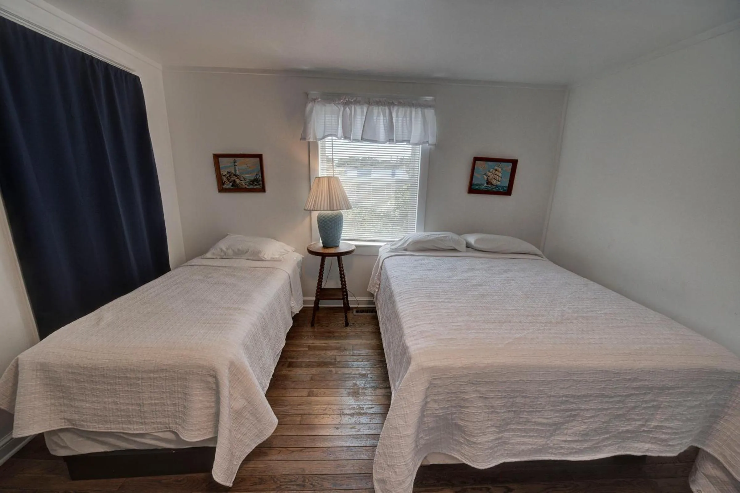 Bed in Outer Banks Motel - Village Accommodations