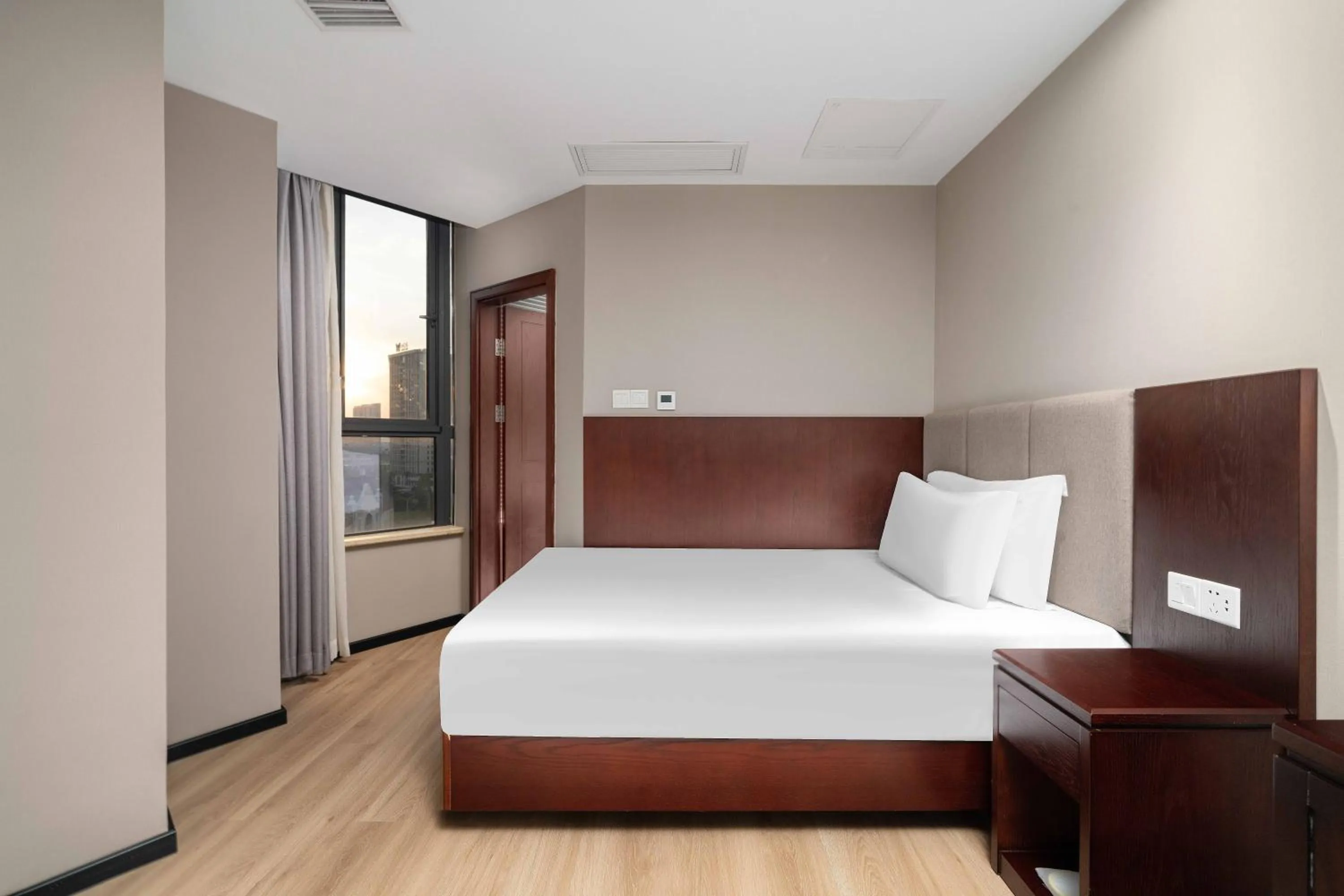 Bed in Huzhou Wealth Hotel