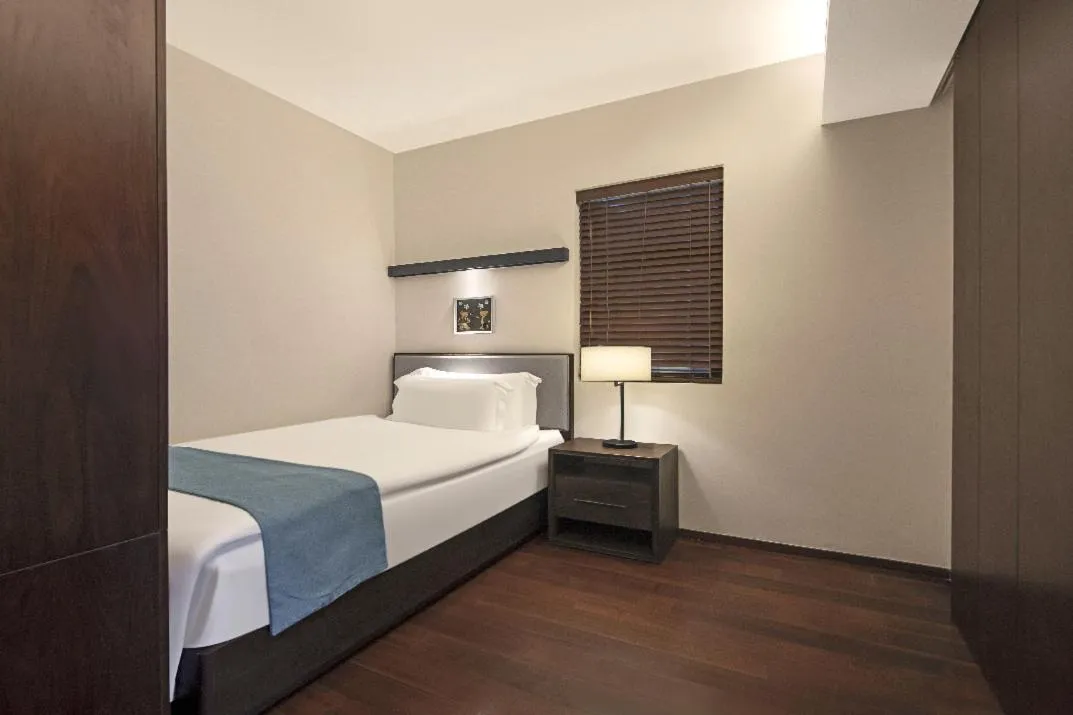 Bed in Howard Johnson Sandalwoods Resort Huizhou