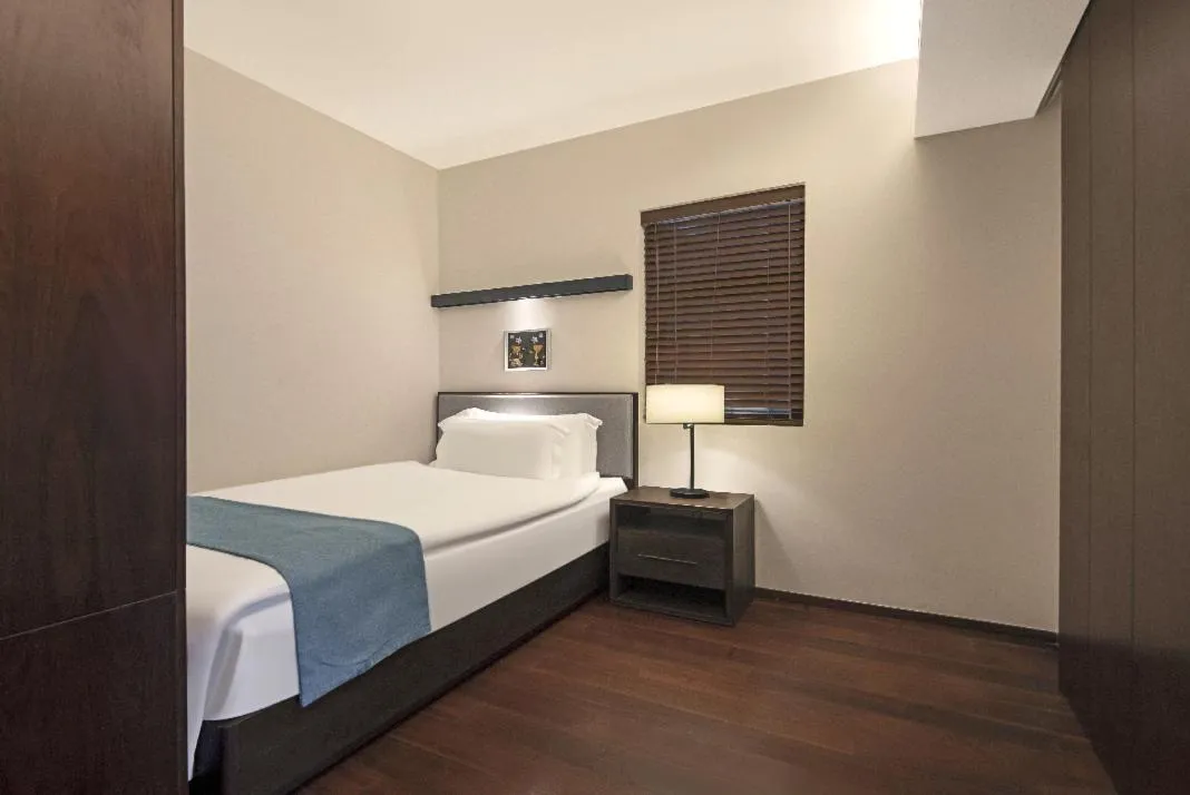 Bed in Howard Johnson Sandalwoods Resort Huizhou