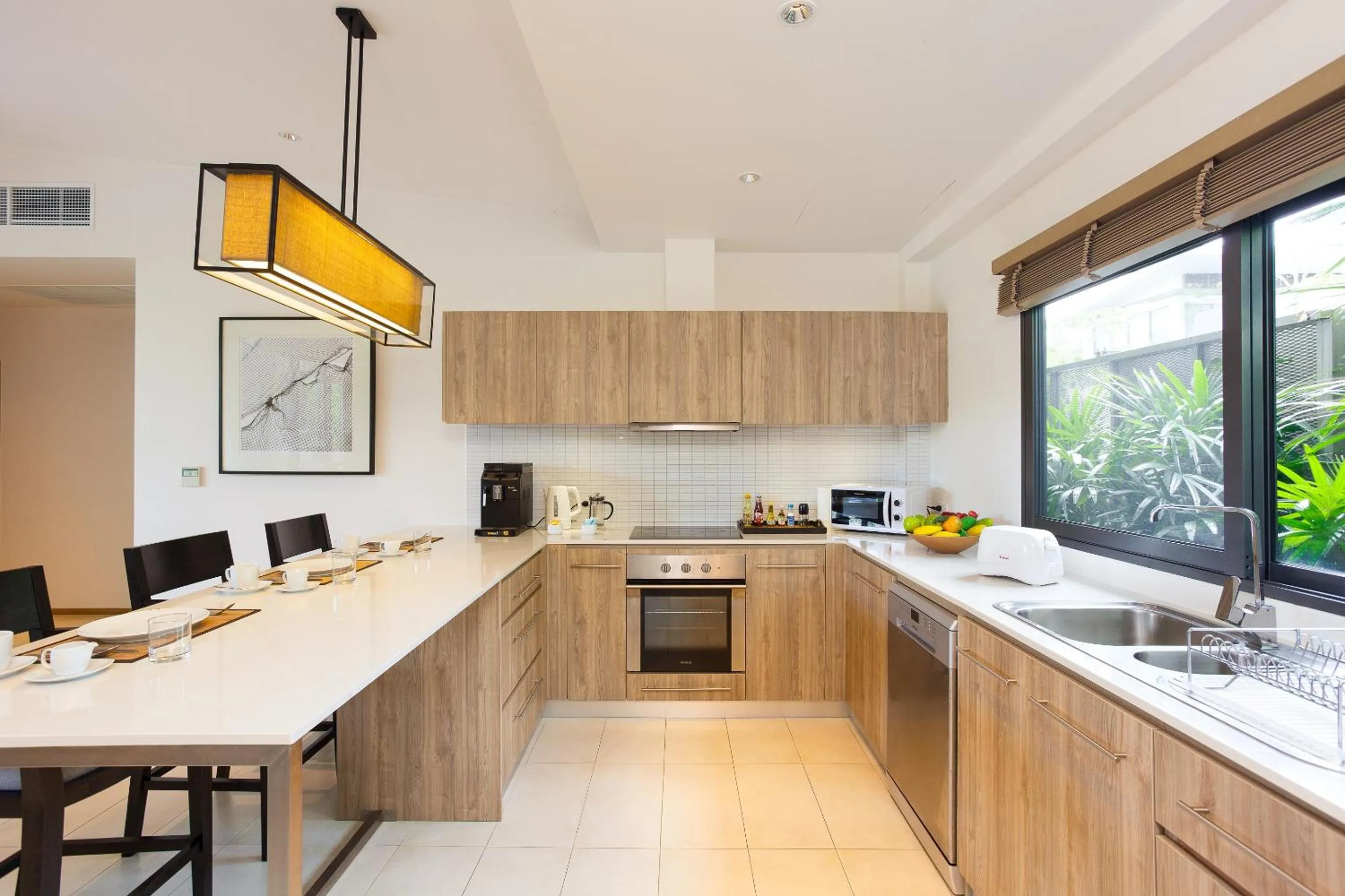 Kitchen or kitchenette in CASABAY Luxury Pool Villas by STAY
