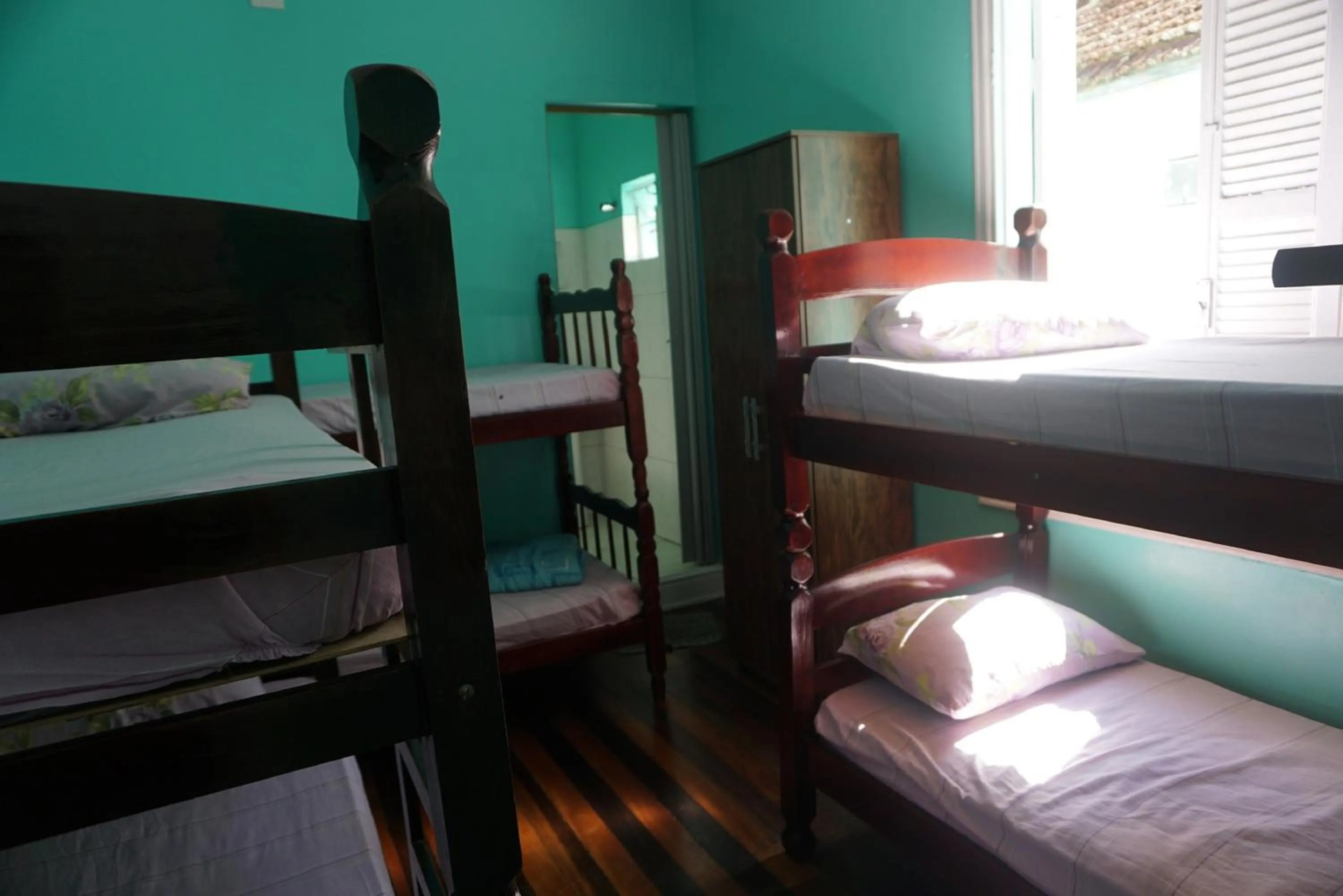 Bed in Pousada Orquidário