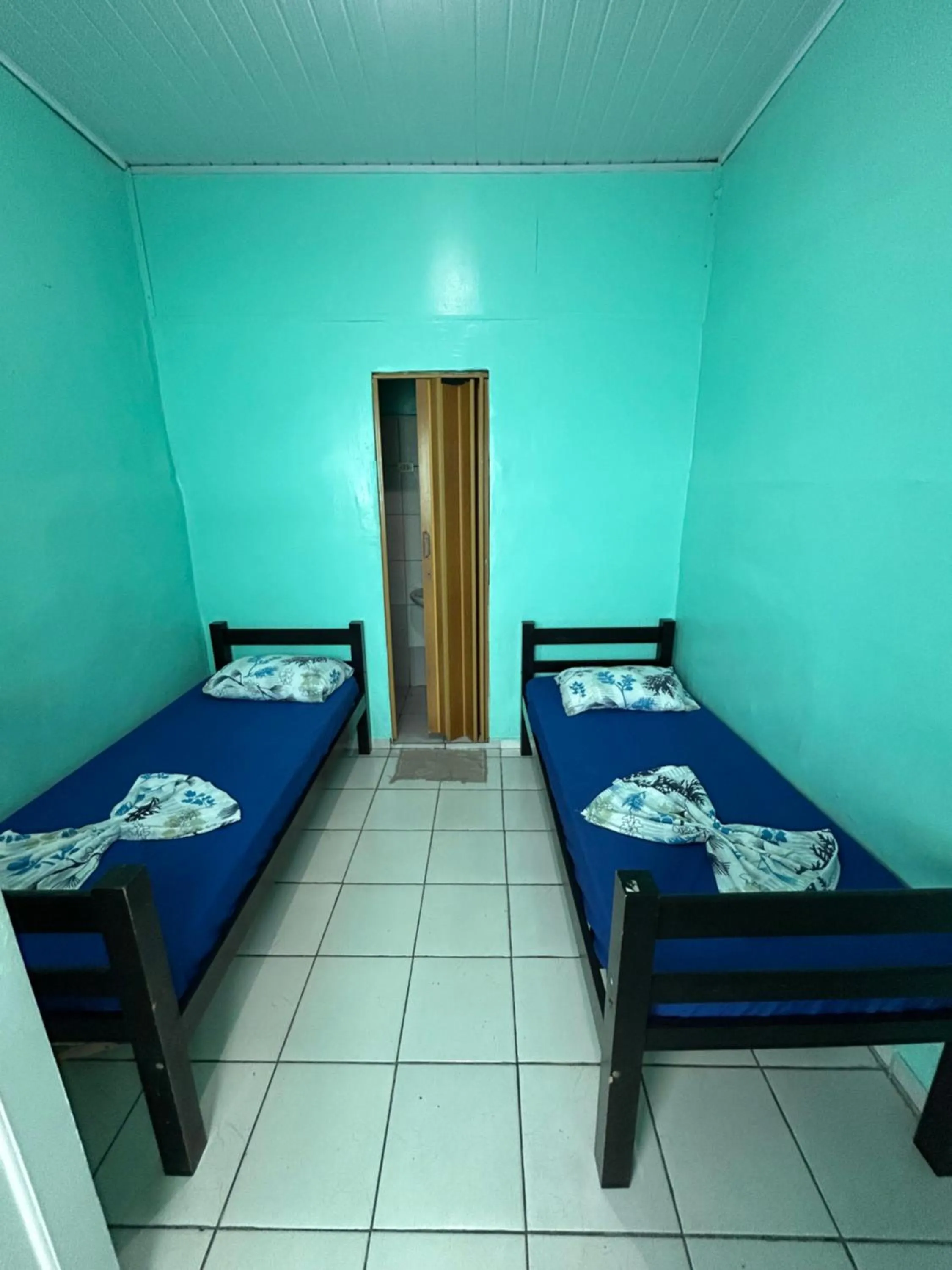 Bed in Pousada Orquidário