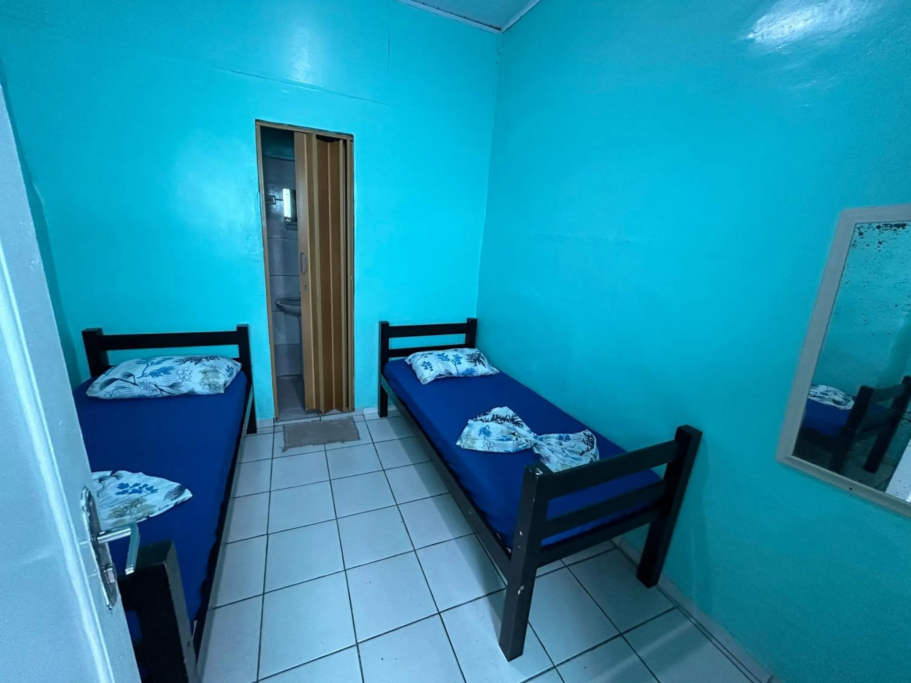 Bed in Pousada Orquidário