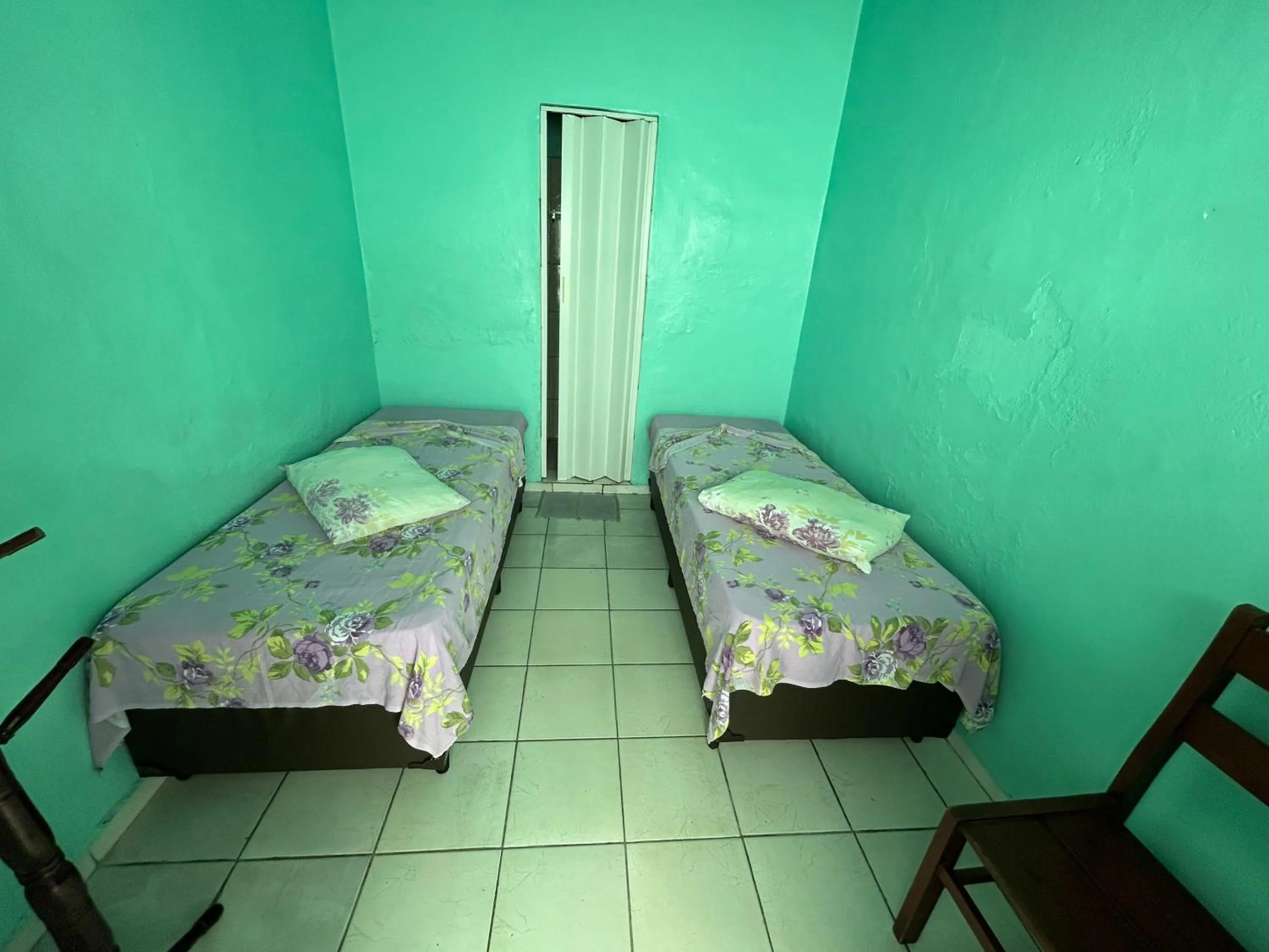 Bed in Pousada Orquidário