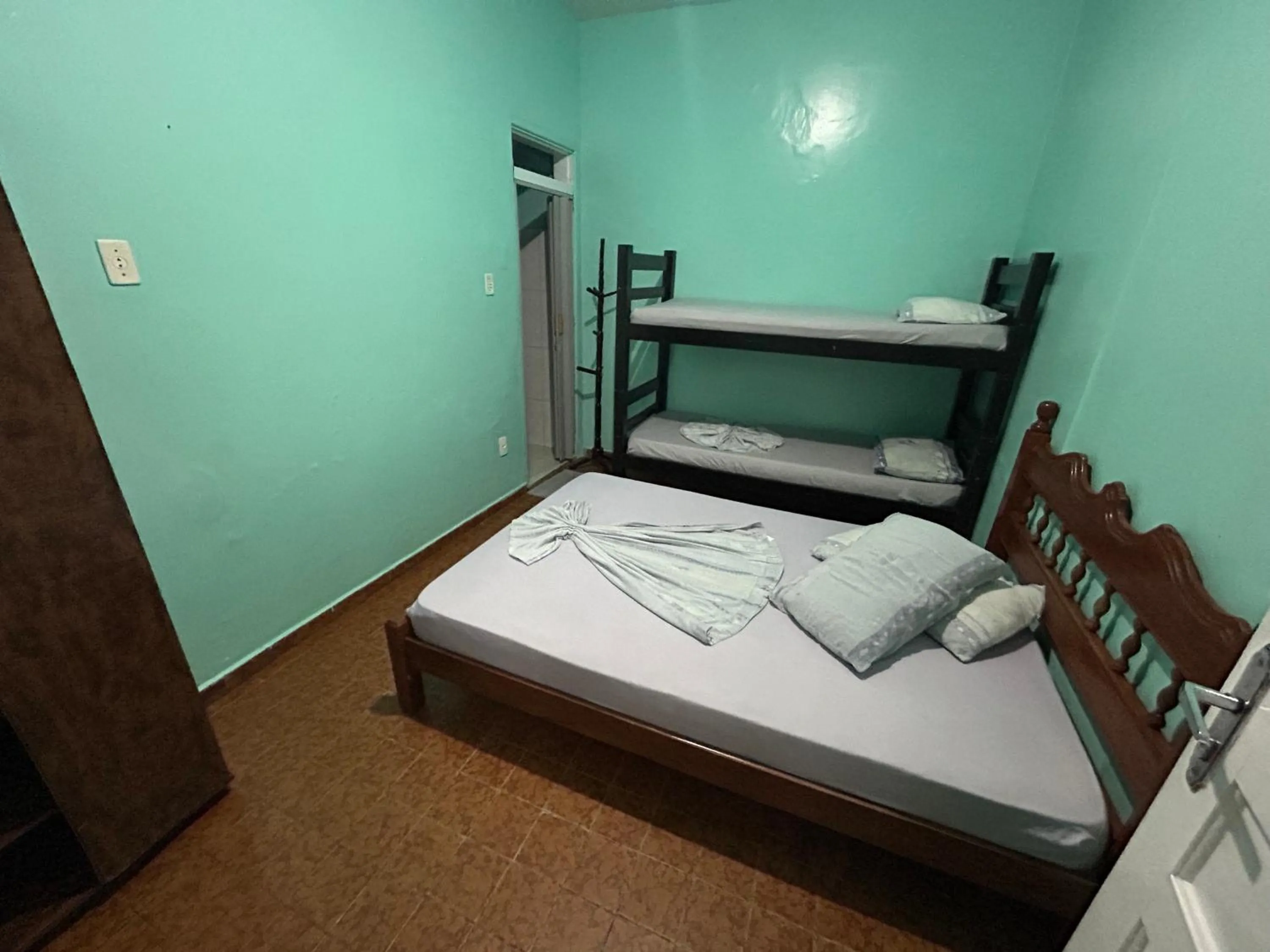 Bed in Pousada Orquidário