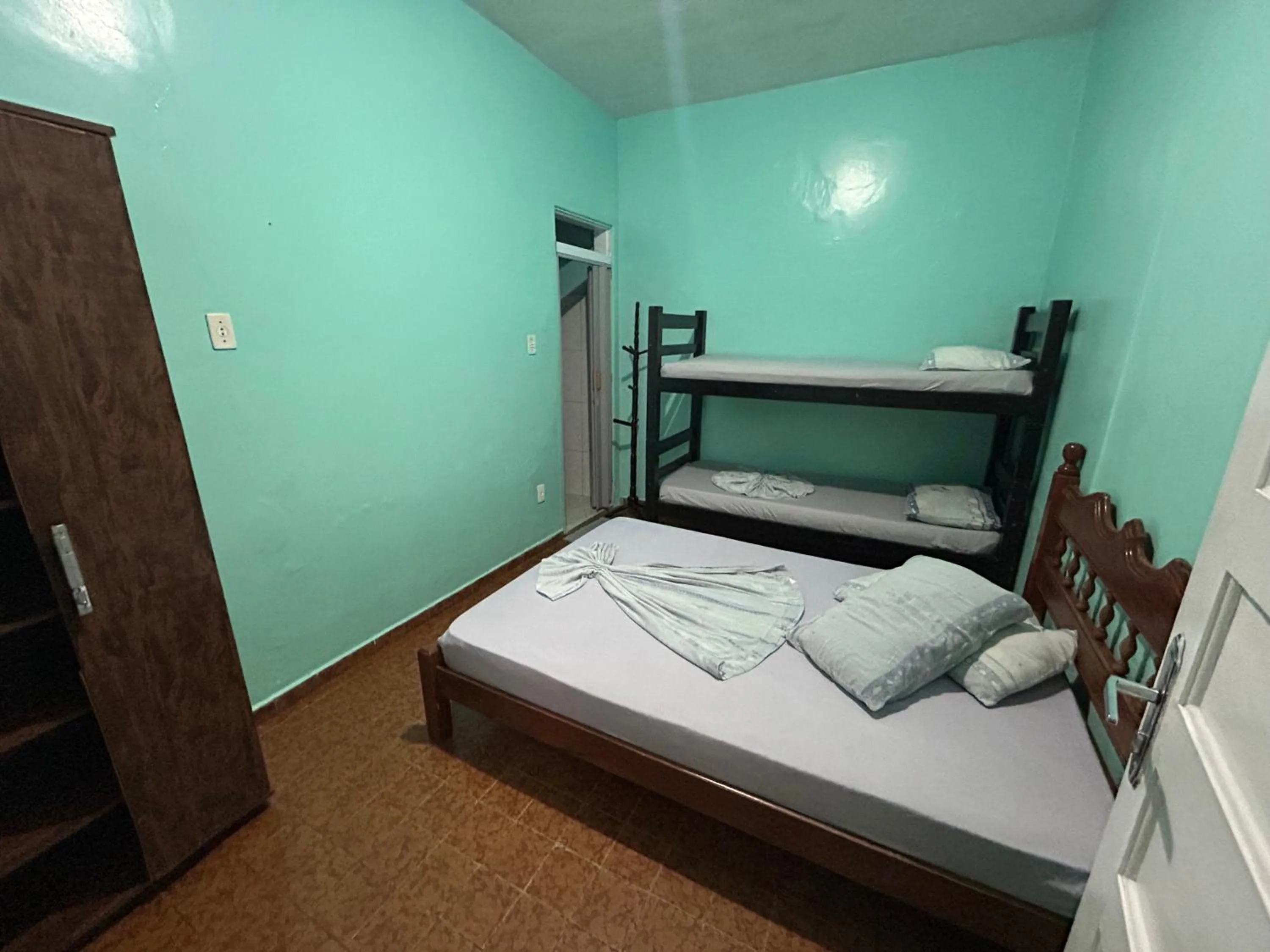 Bed in Pousada Orquidário