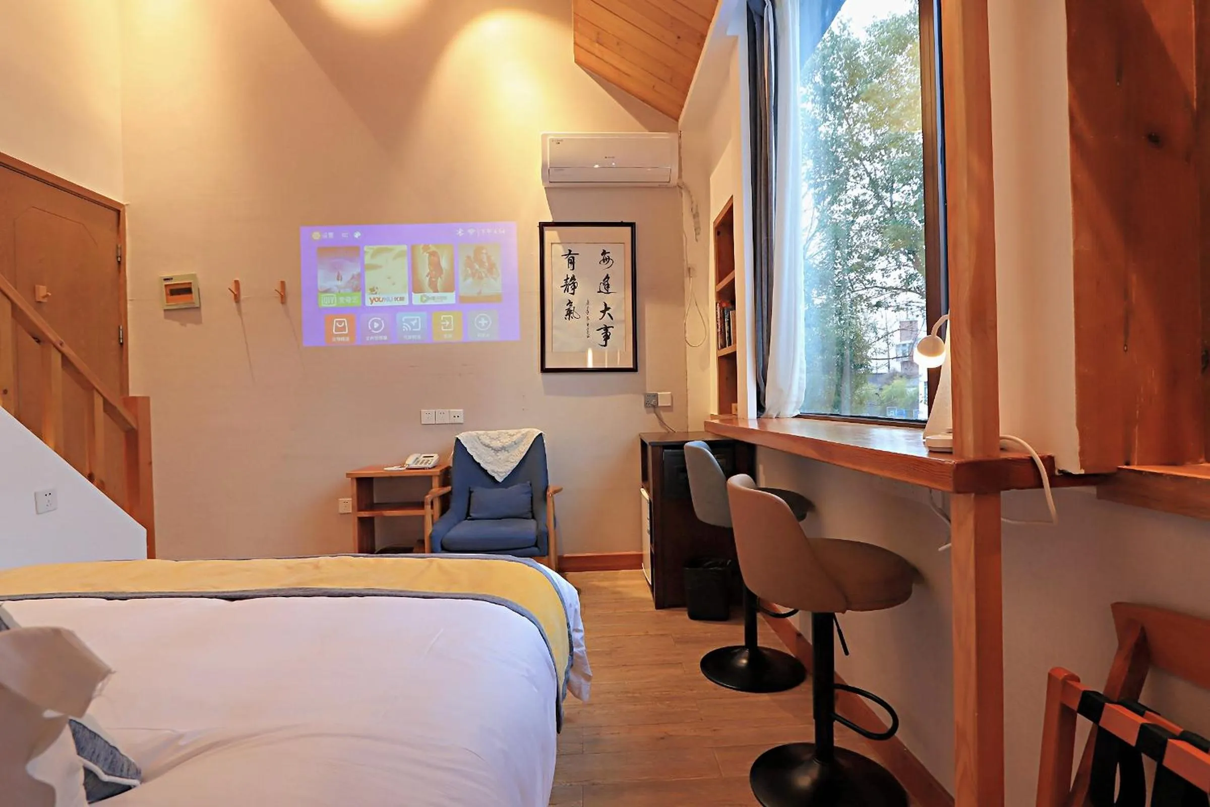 Communal lounge/ TV room, Bed in Mild Spring Boutique Hotel