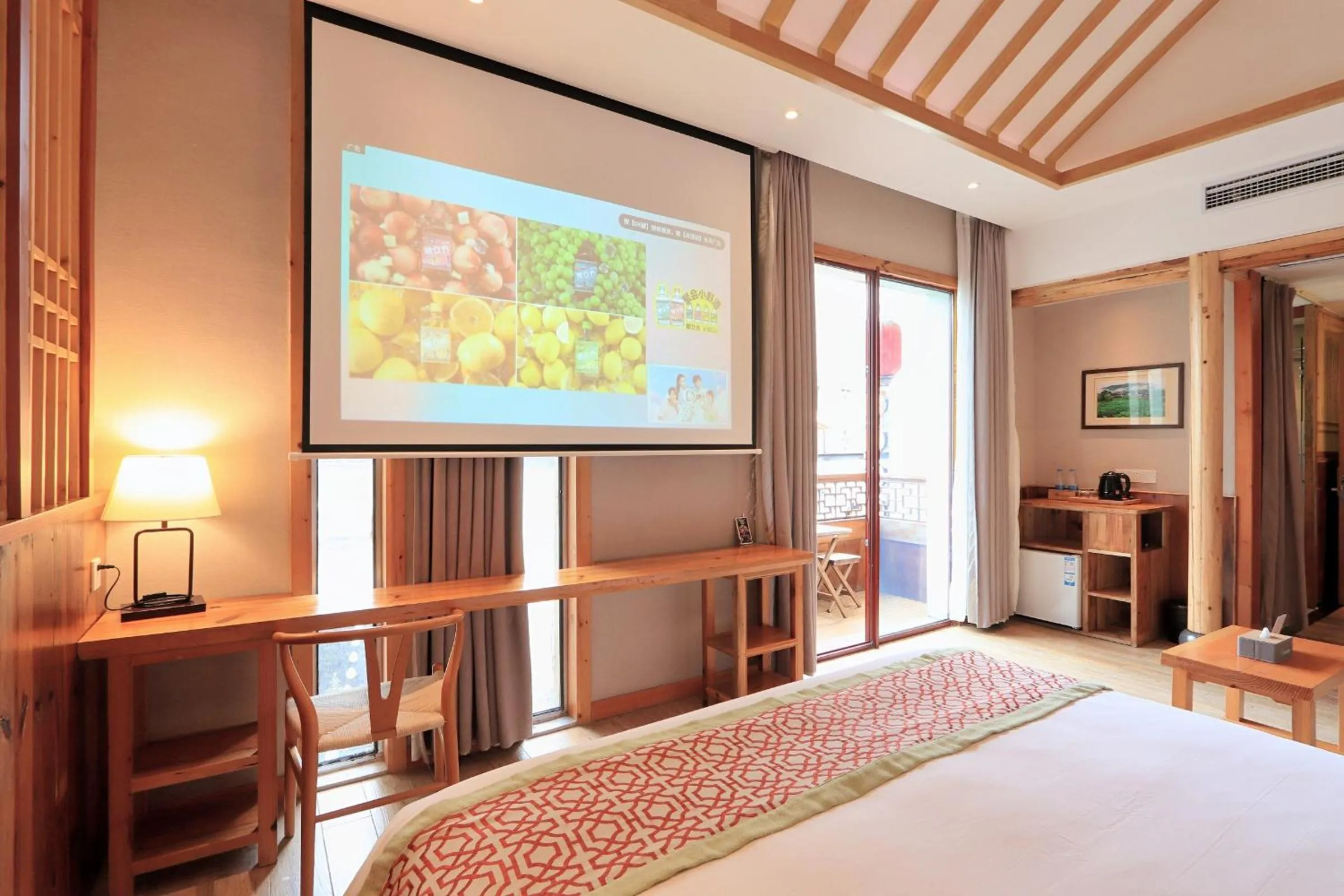 Communal lounge/ TV room, Bed in Mild Spring Boutique Hotel