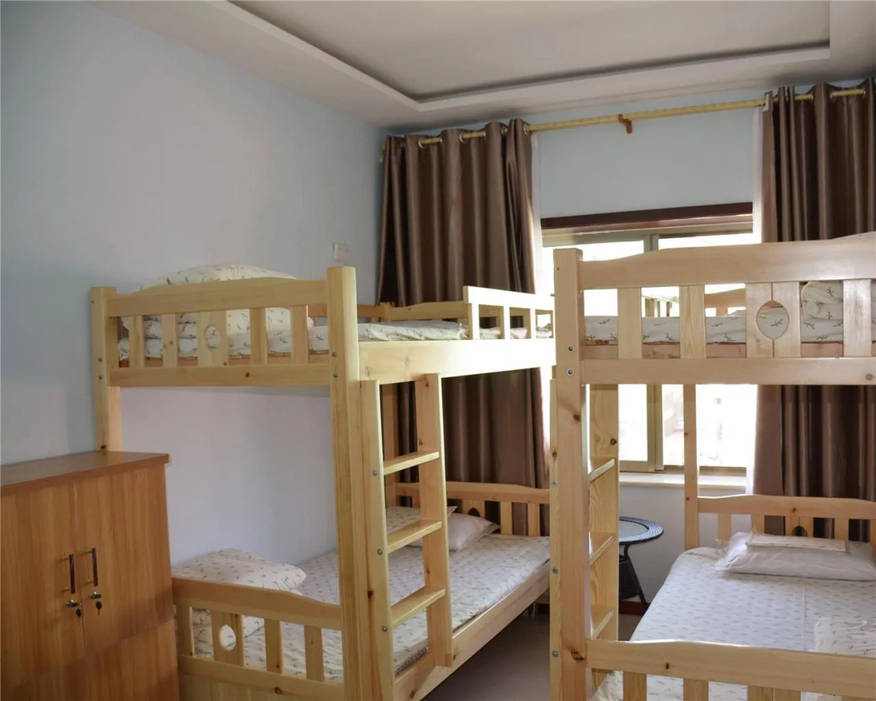Bed in 4-Bed Male Dormitory Room - air conditioner in The Silk Road Travelers Hostel