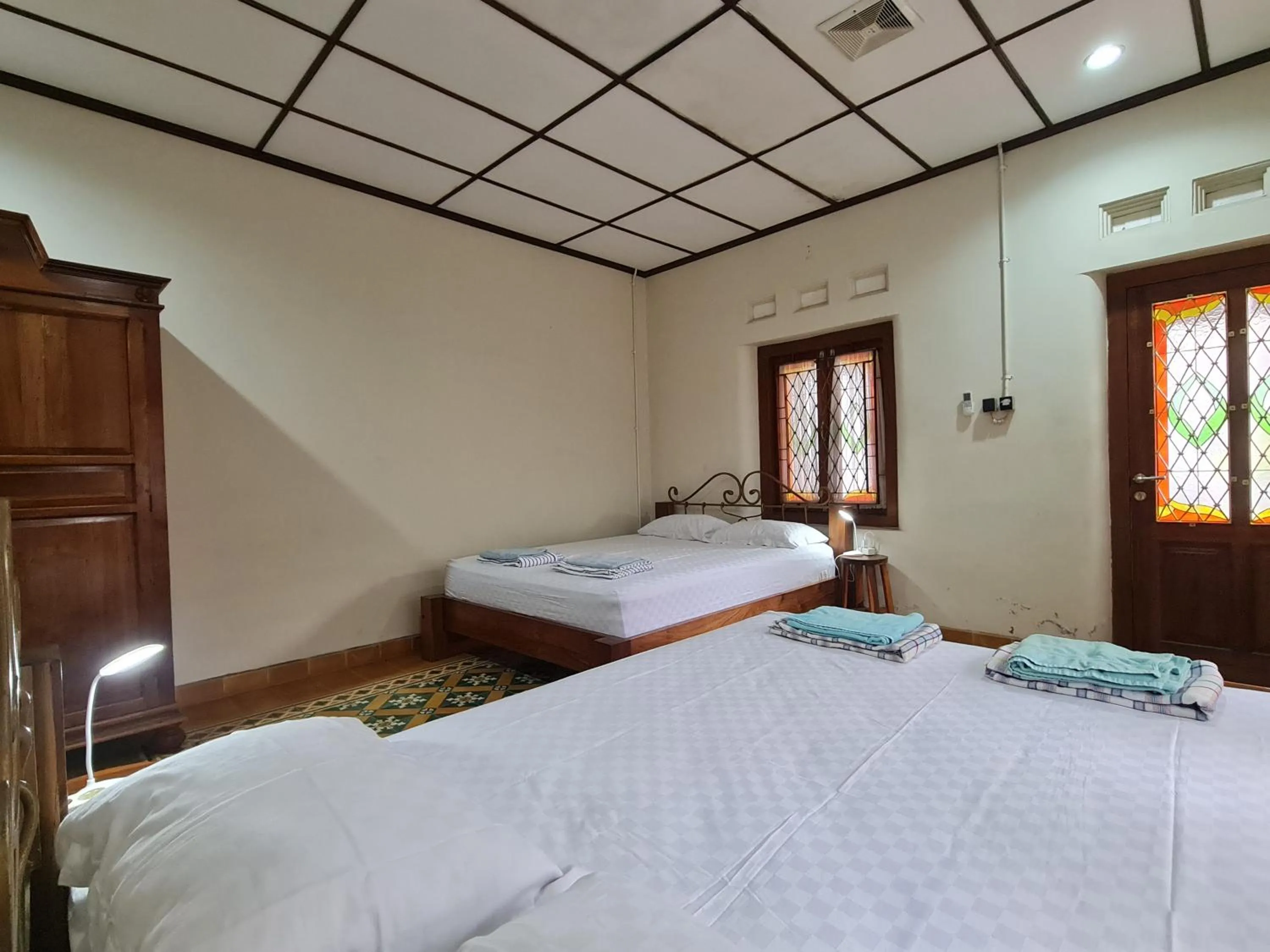 Bed in Omah Pitoe Yogya Homestay