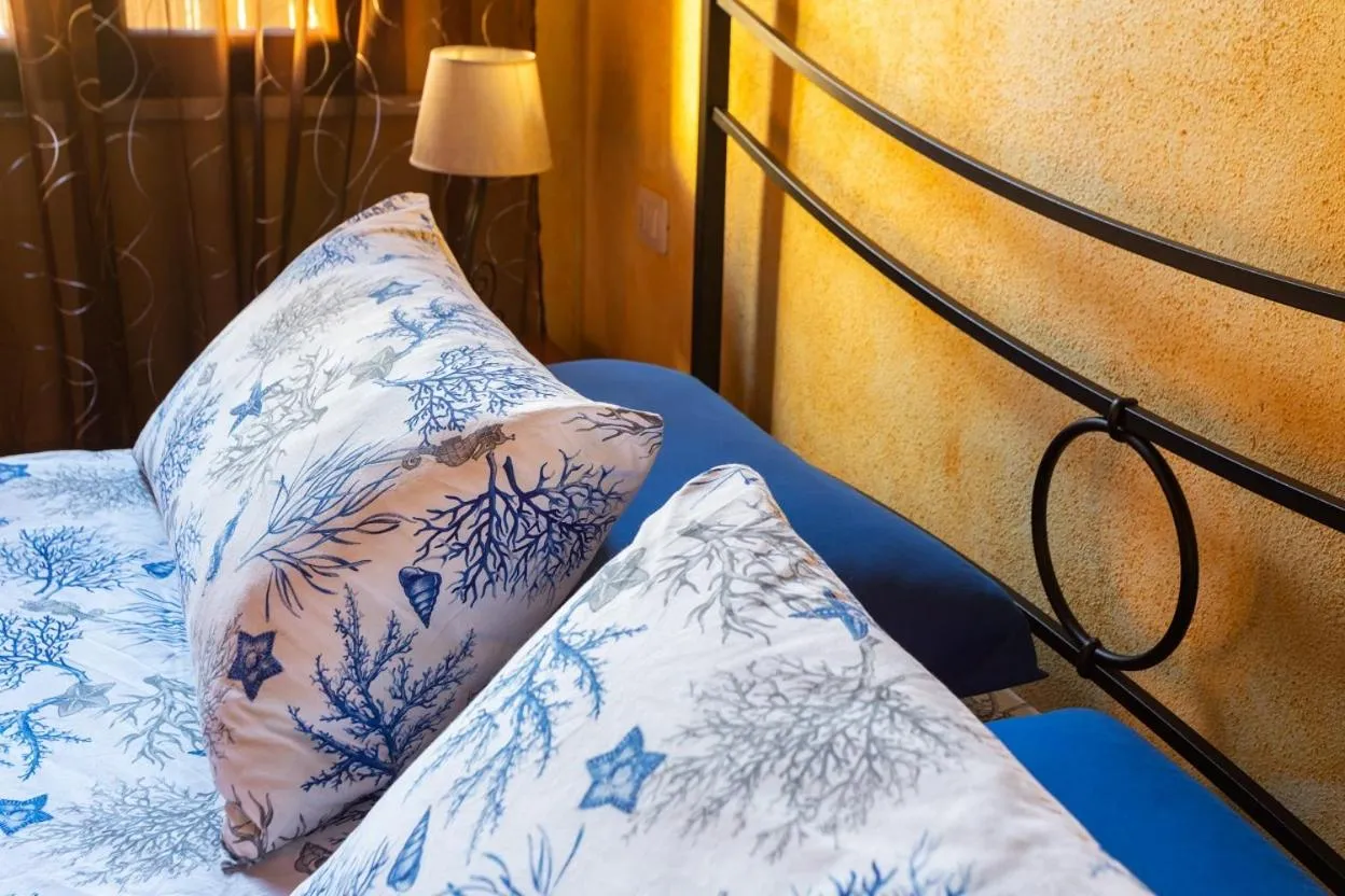 Bed in Affittacamere Shardana