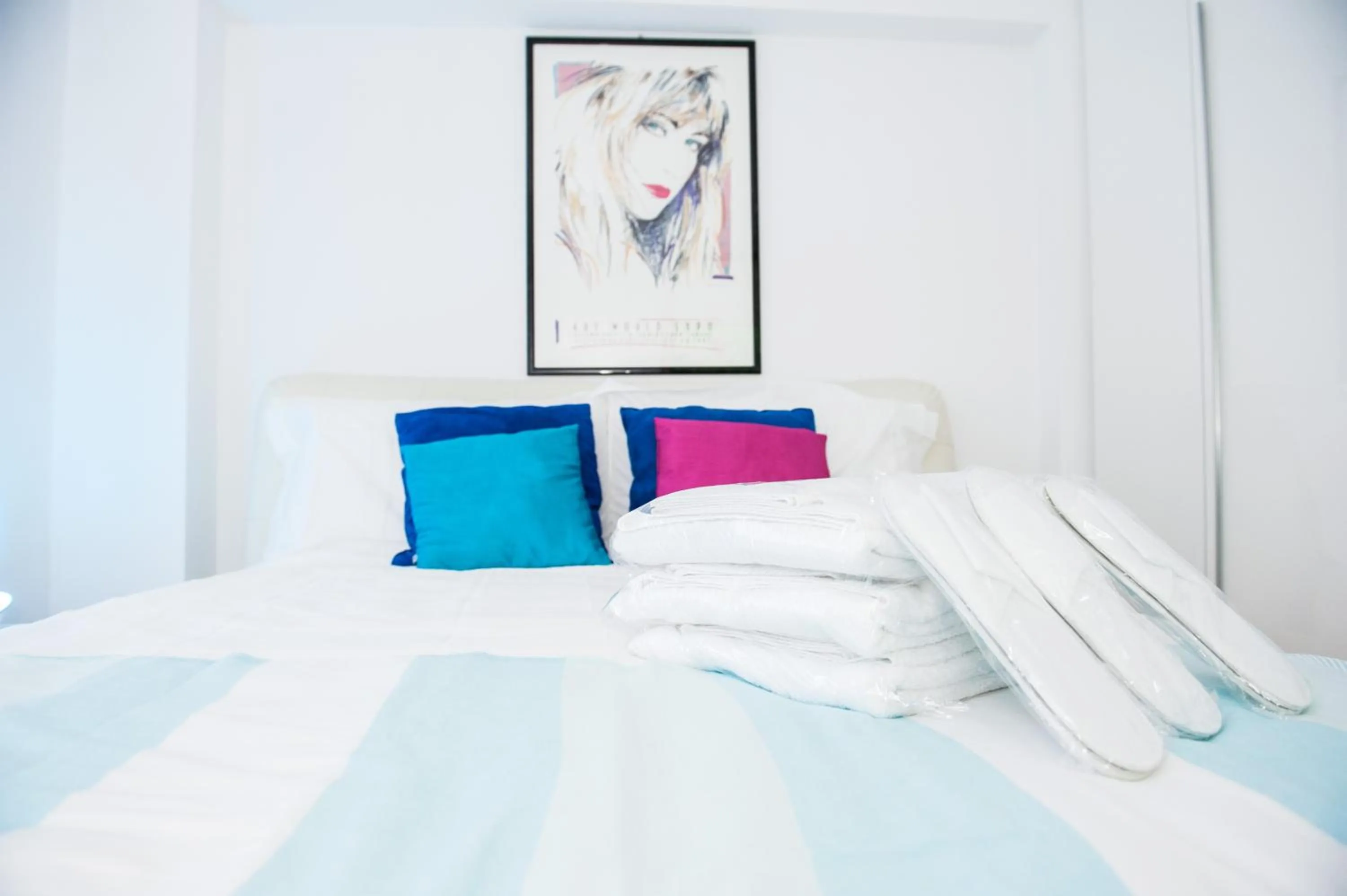 Bed in White Dream Suites