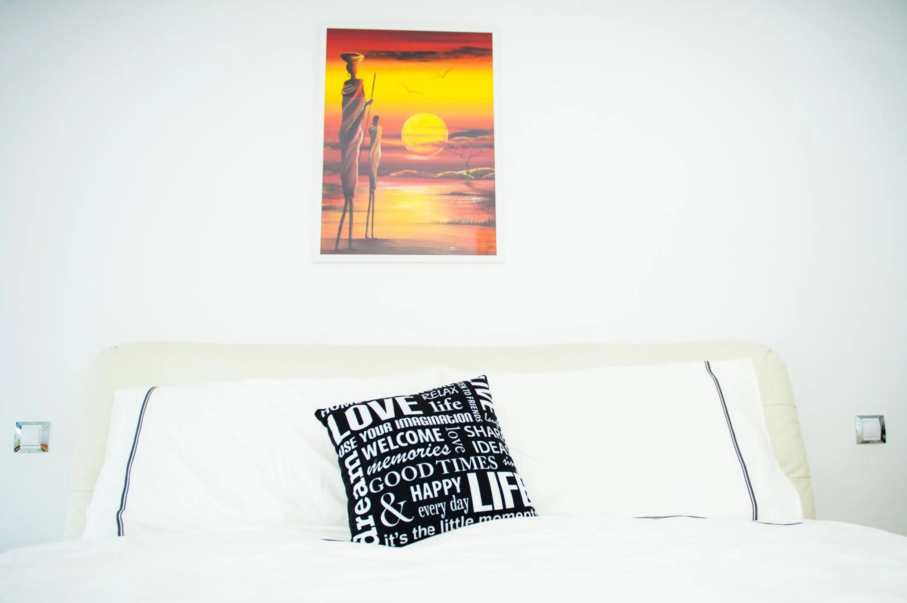 Bed in White Dream Suites