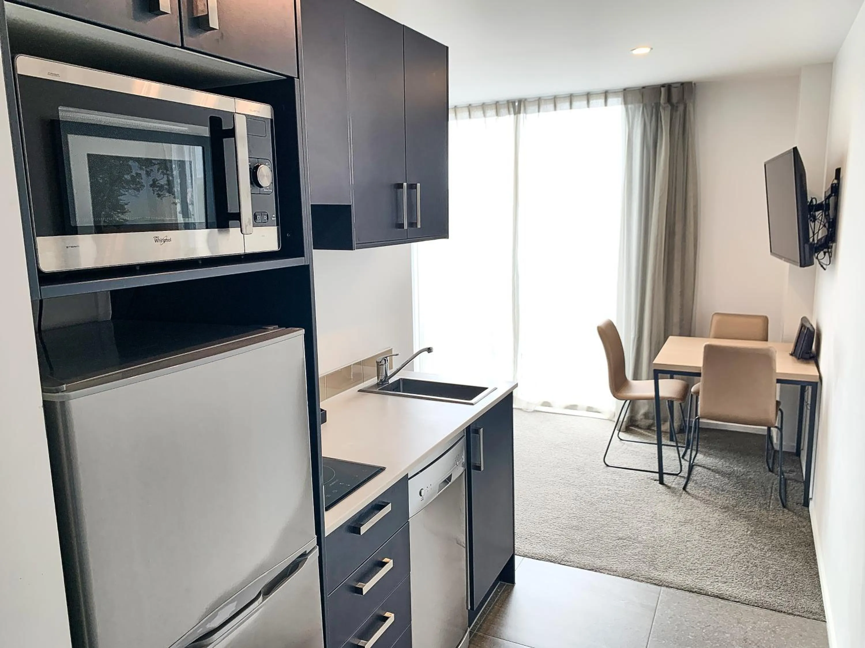 Kitchen or kitchenette in Ramada Suites by Wyndham Albany