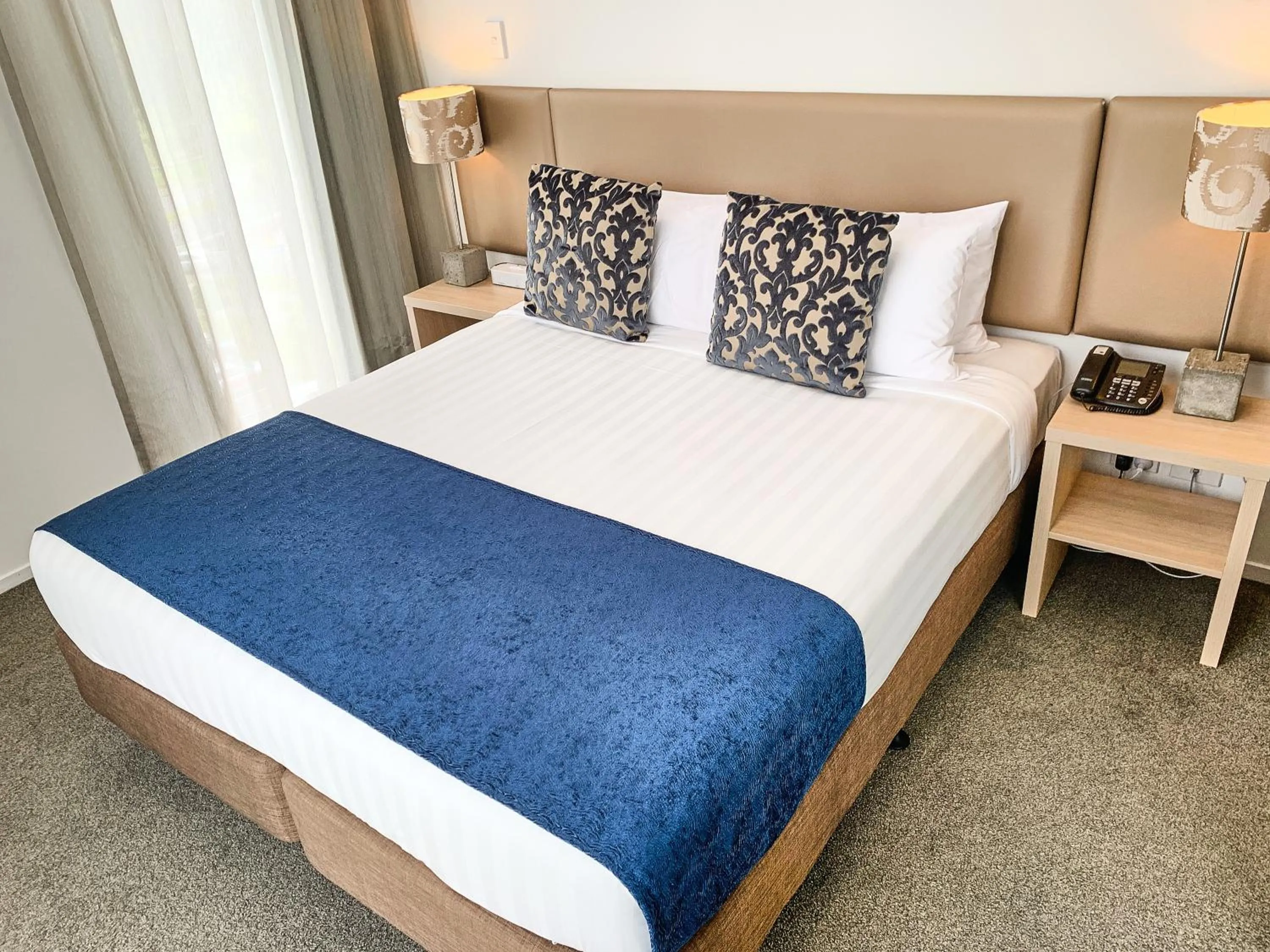 Bed in Ramada Suites by Wyndham Albany