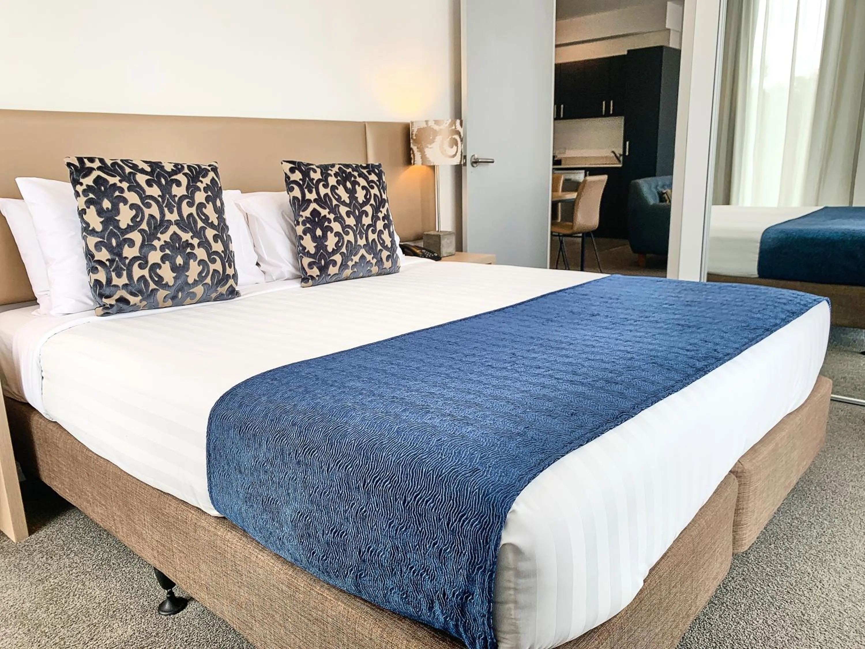 Bed in Ramada Suites by Wyndham Albany