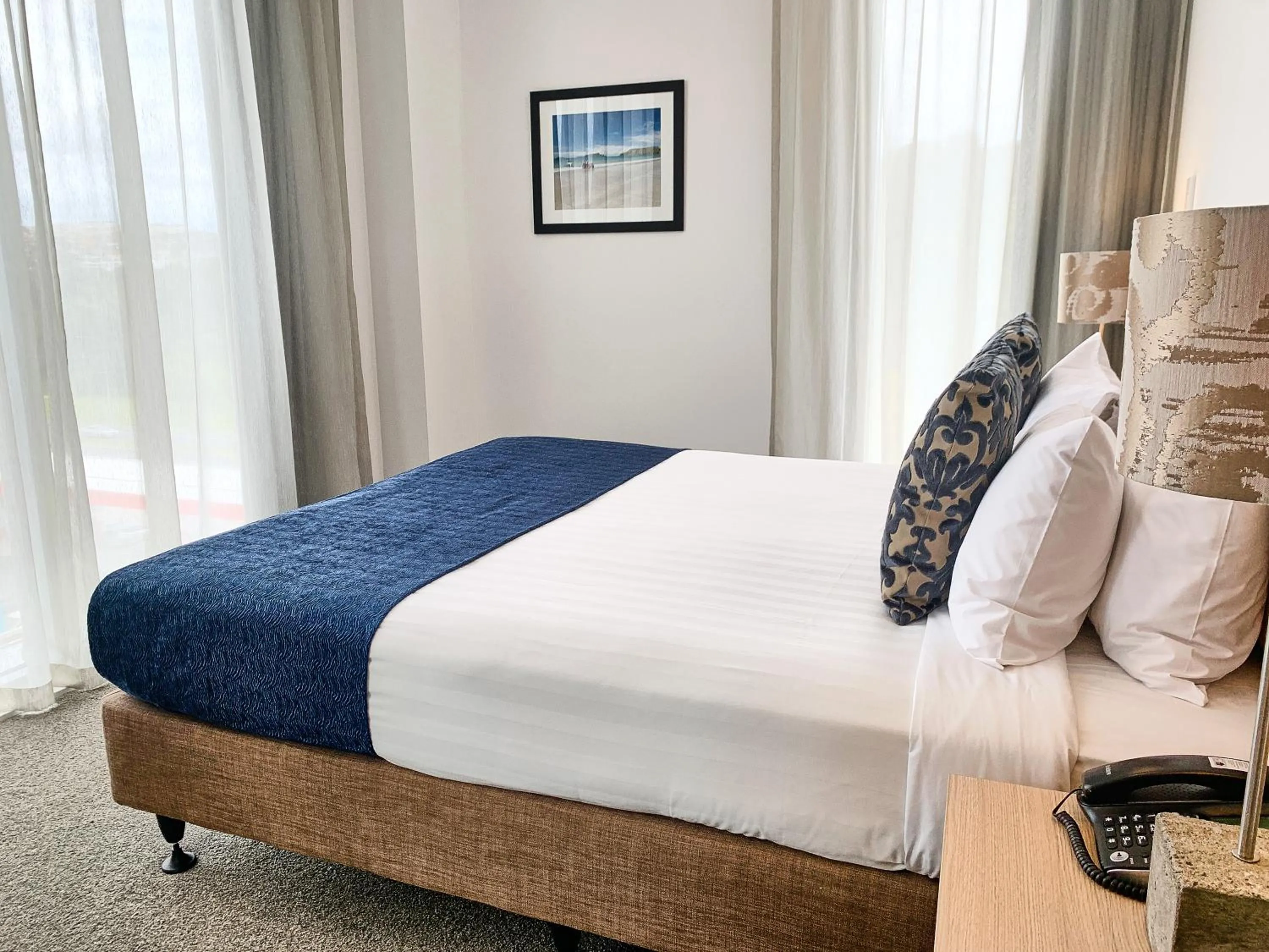 Bed in Ramada Suites by Wyndham Albany