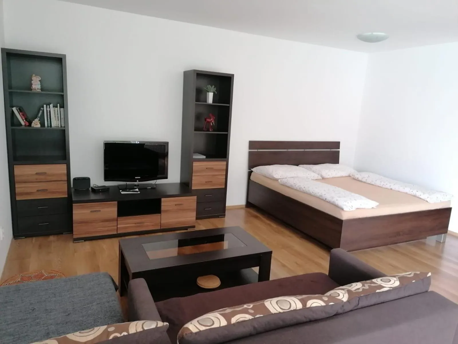 Living room, Bed in Modern city center apartment with private parking