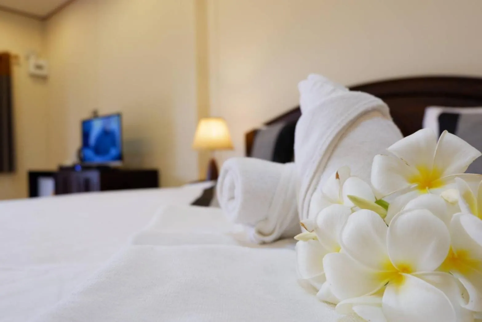 Bed in NanBaanKhun Hotel