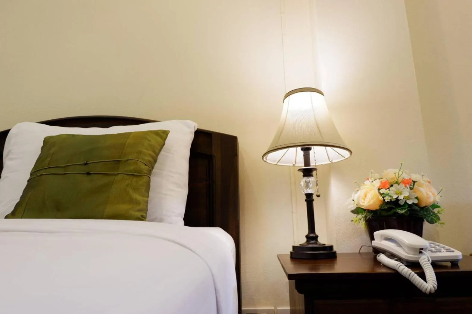 Bed in NanBaanKhun Hotel