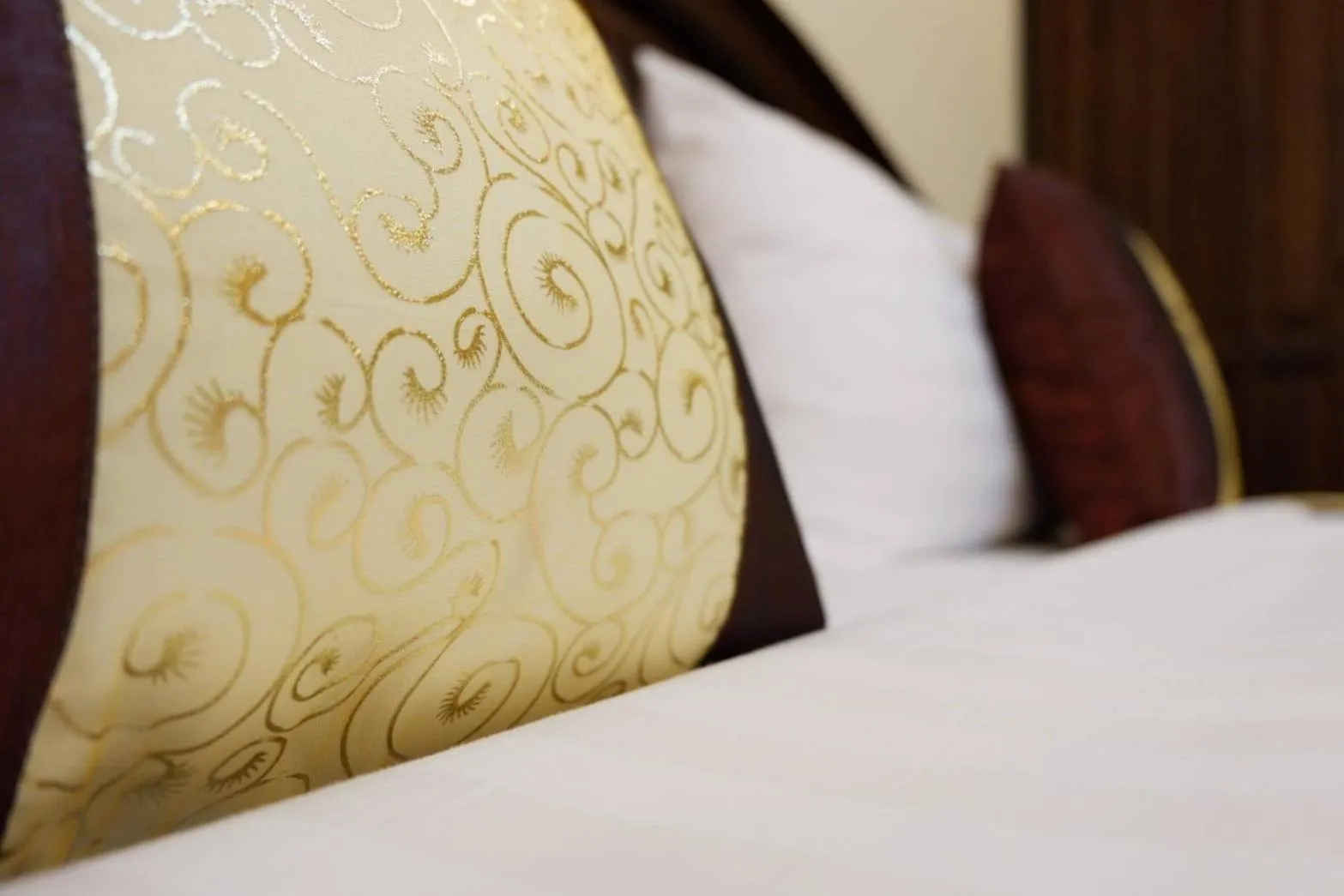 Bed in NanBaanKhun Hotel