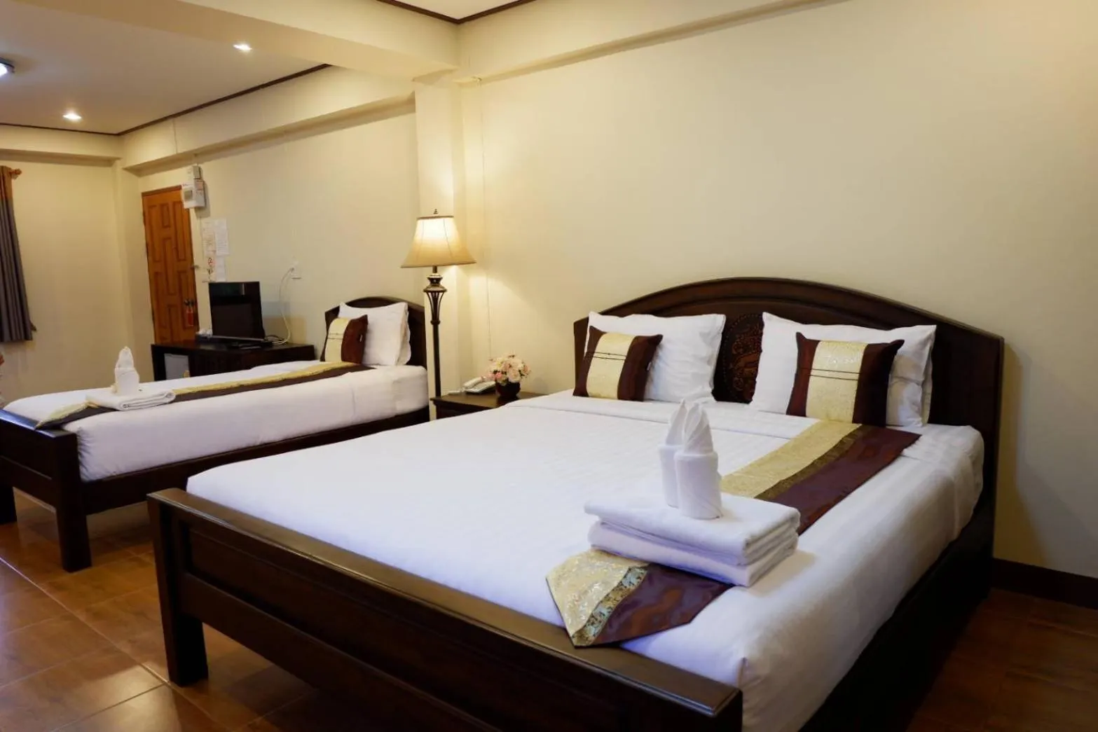 Bed in NanBaanKhun Hotel