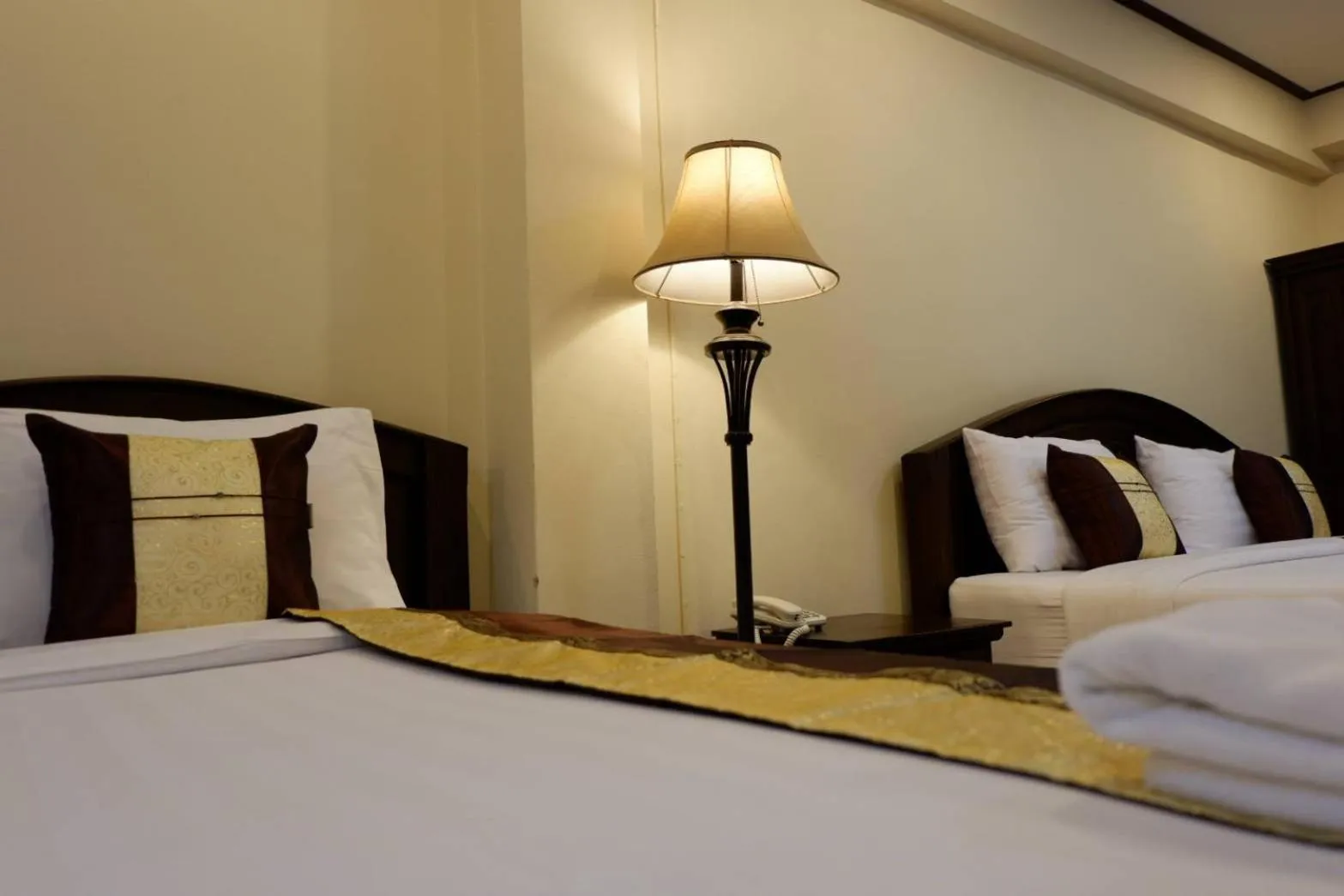 Bed in NanBaanKhun Hotel