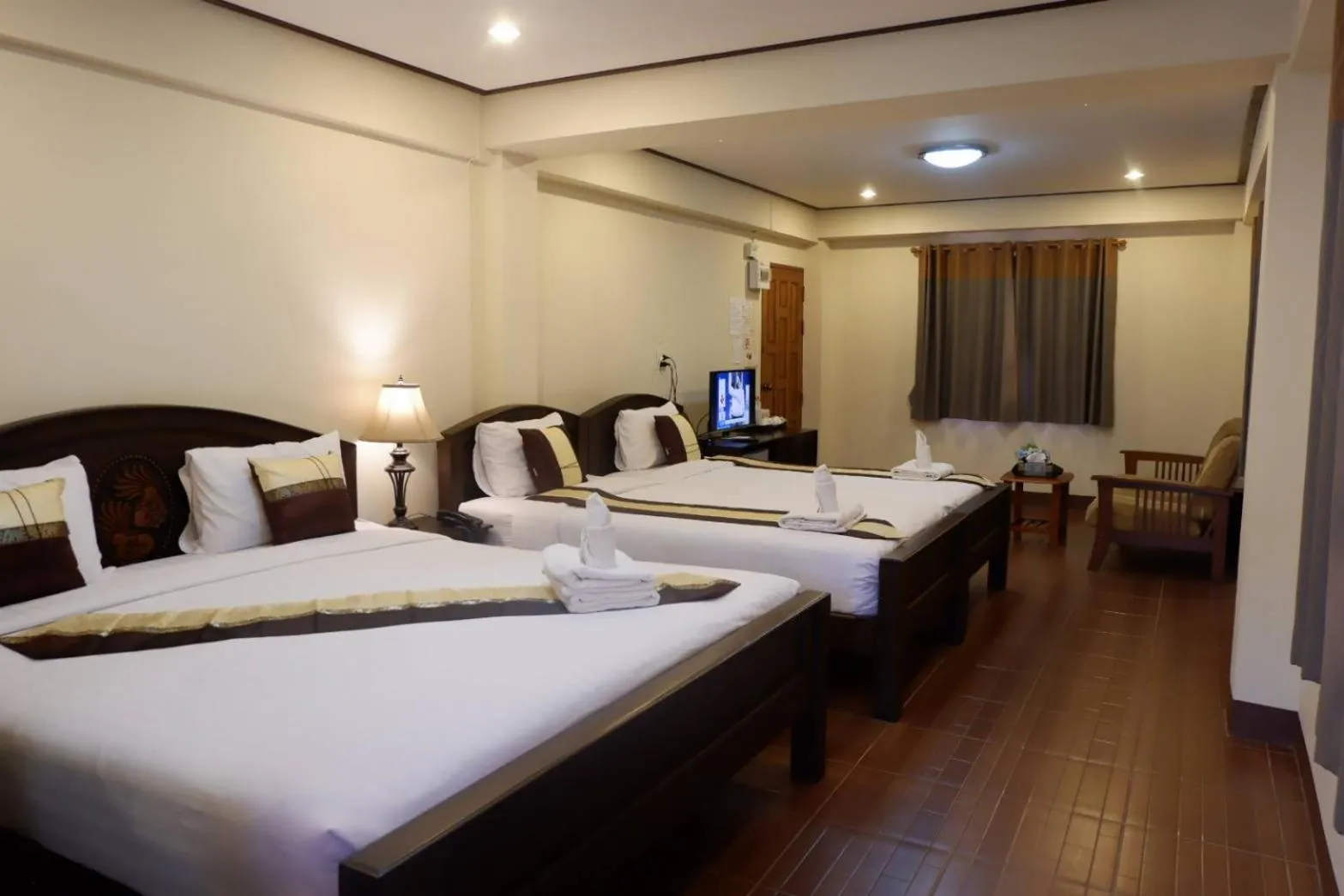 Bed in NanBaanKhun Hotel