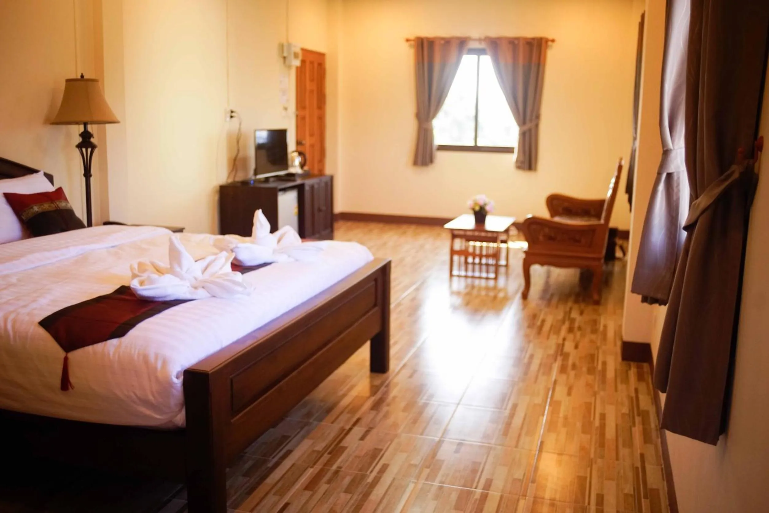 Bed in NanBaanKhun Hotel