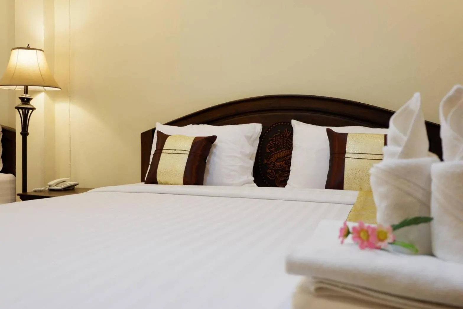 Bed in NanBaanKhun Hotel