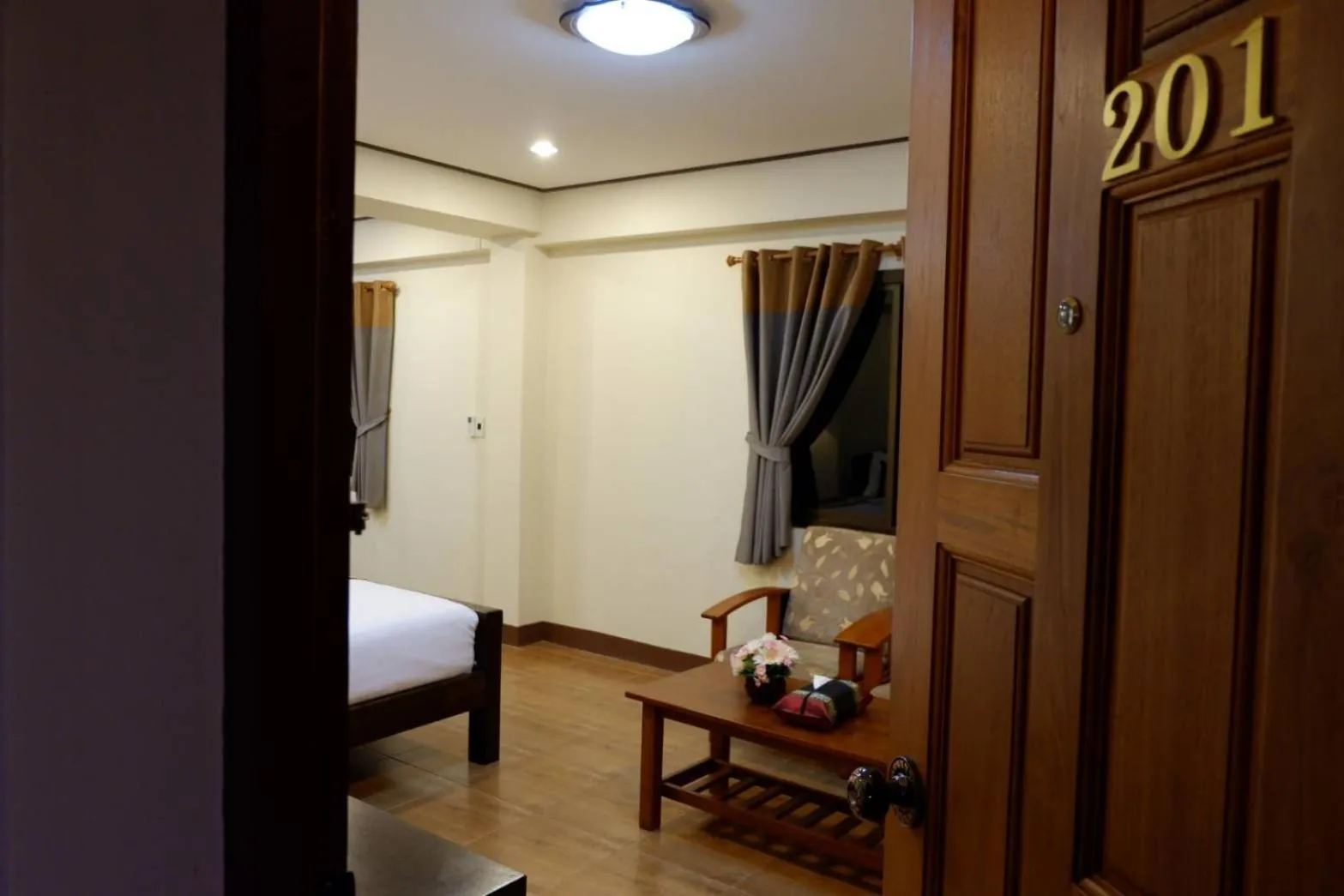 Bed in NanBaanKhun Hotel