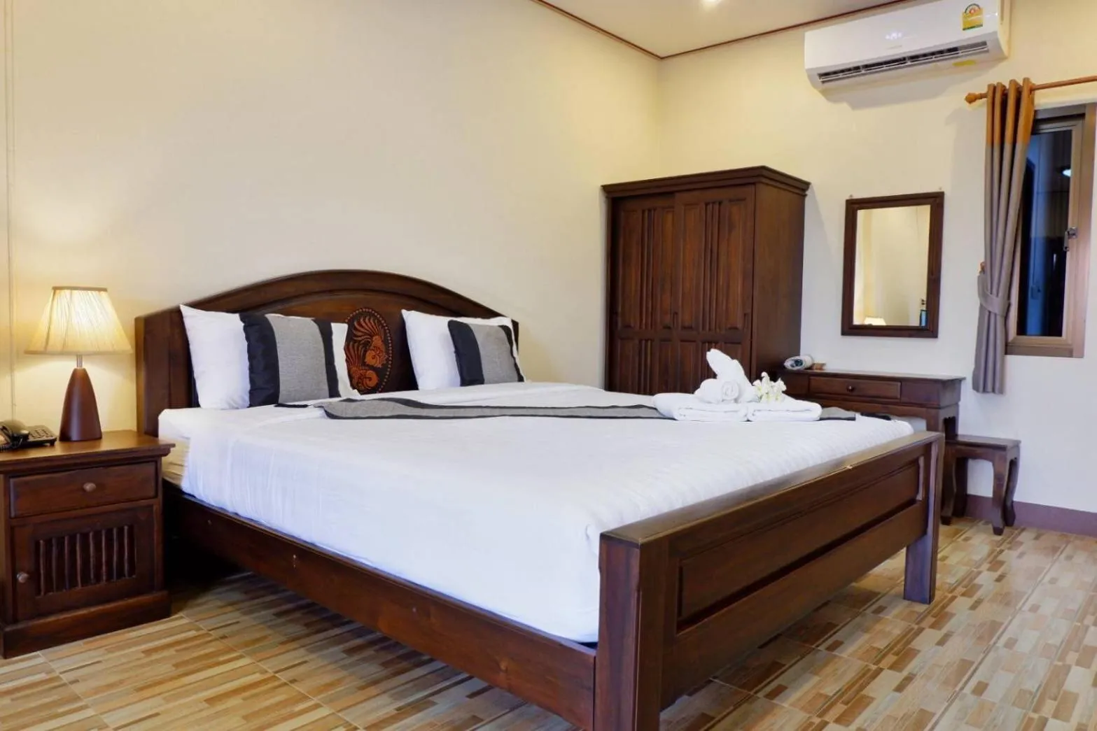 Bed in NanBaanKhun Hotel
