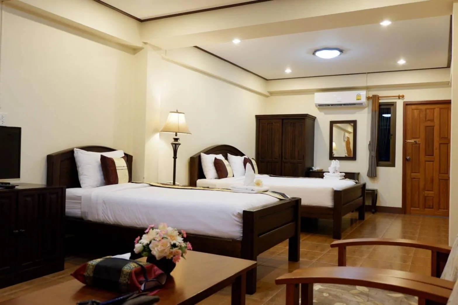 Bed in NanBaanKhun Hotel