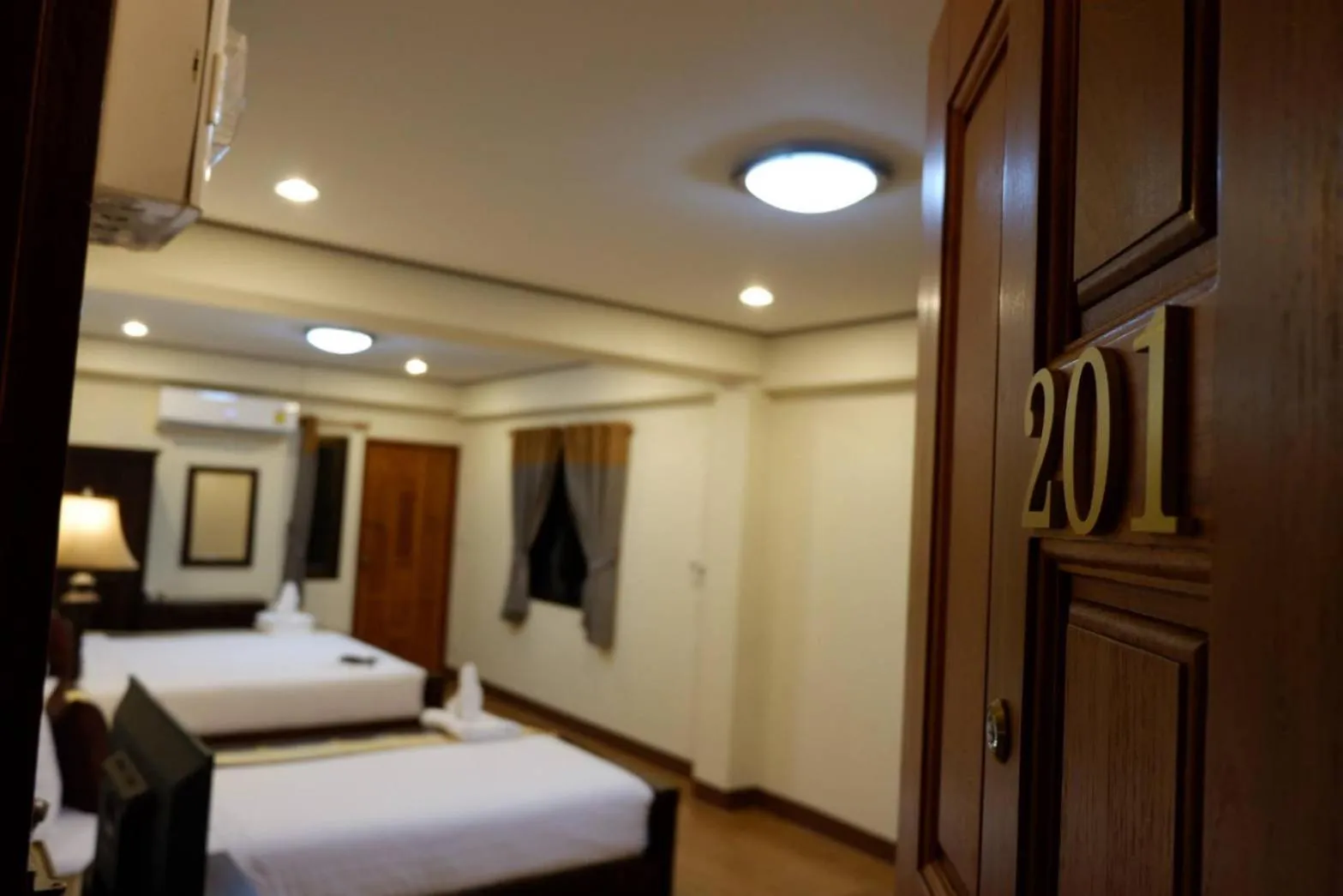 Bed in NanBaanKhun Hotel