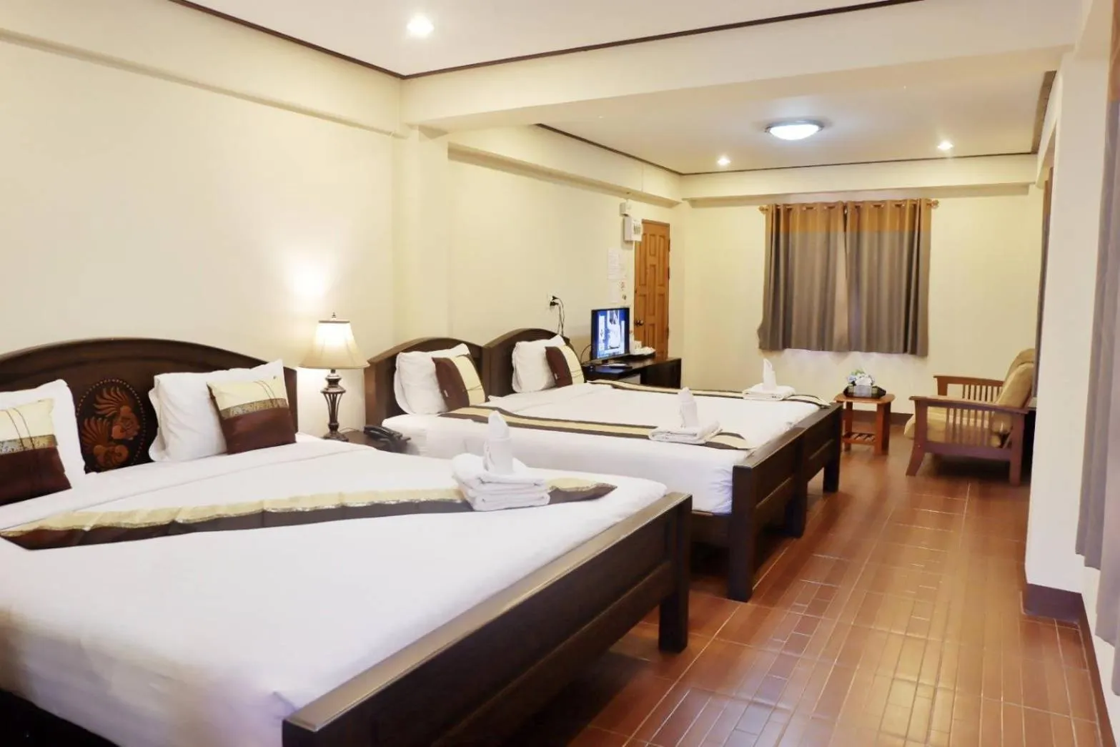 Bed in NanBaanKhun Hotel