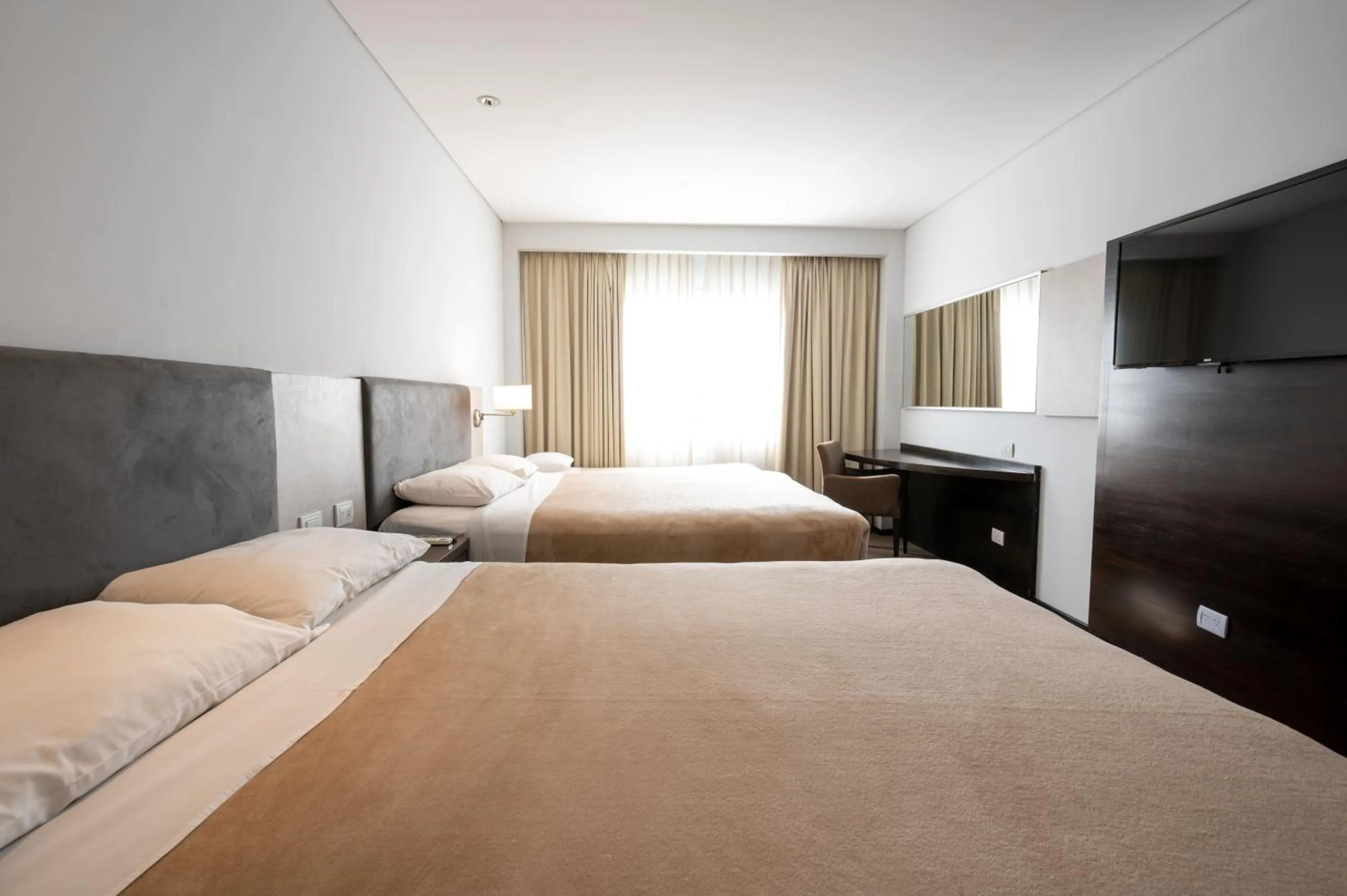 Bed in Howard Johnson Plaza Villa Carlos Paz