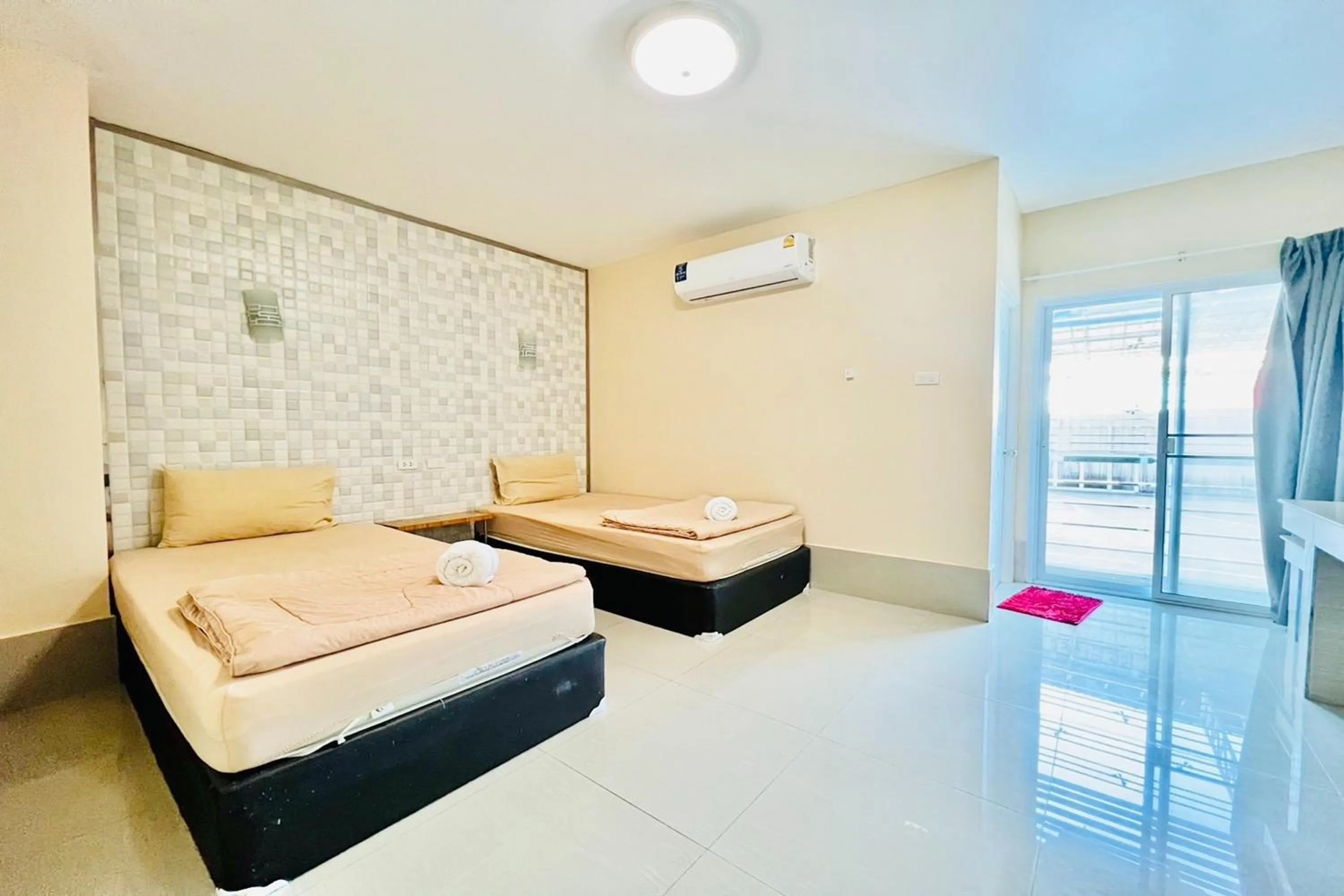 Bed in Veerakit Grand Hotel