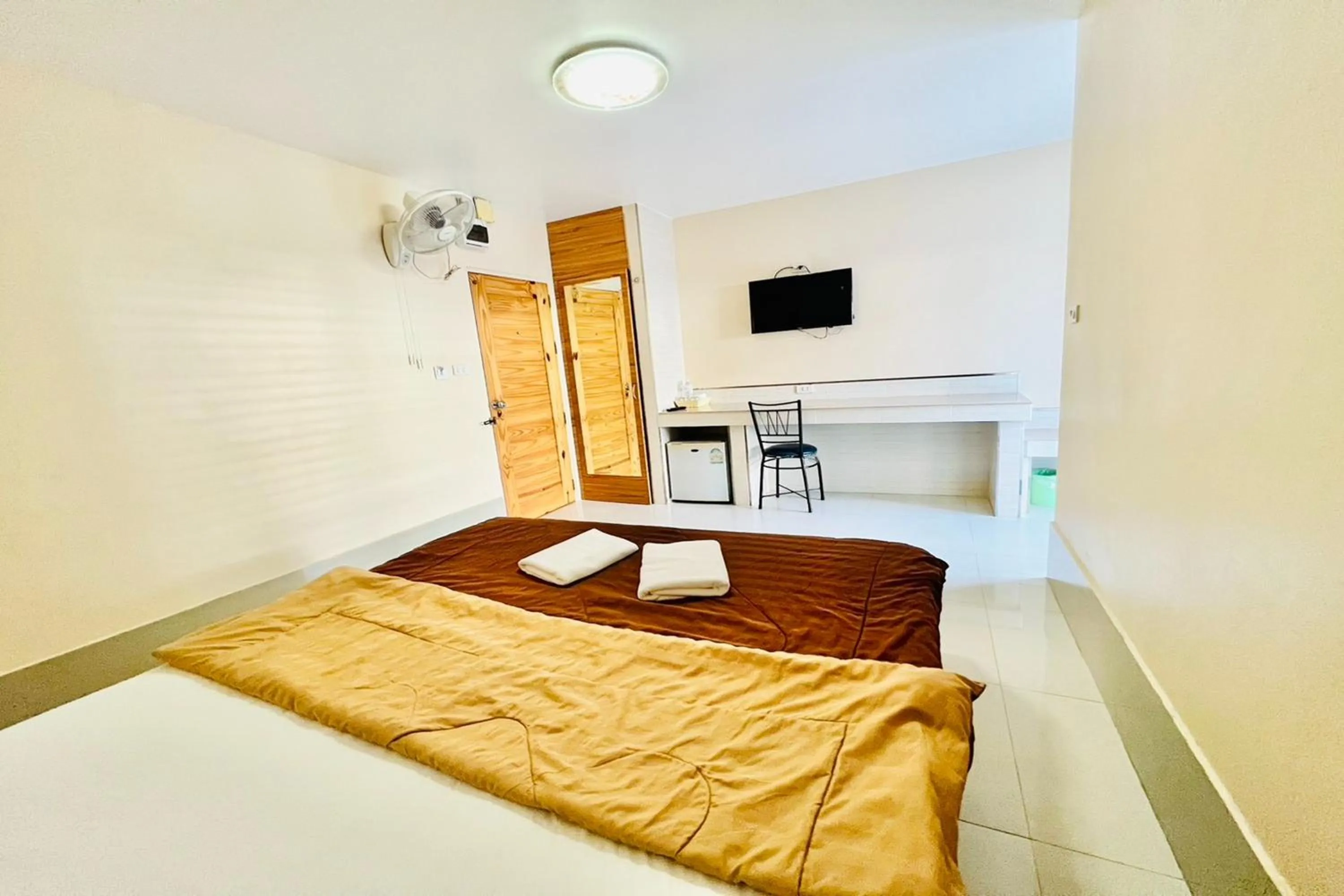 Bed in Veerakit Grand Hotel