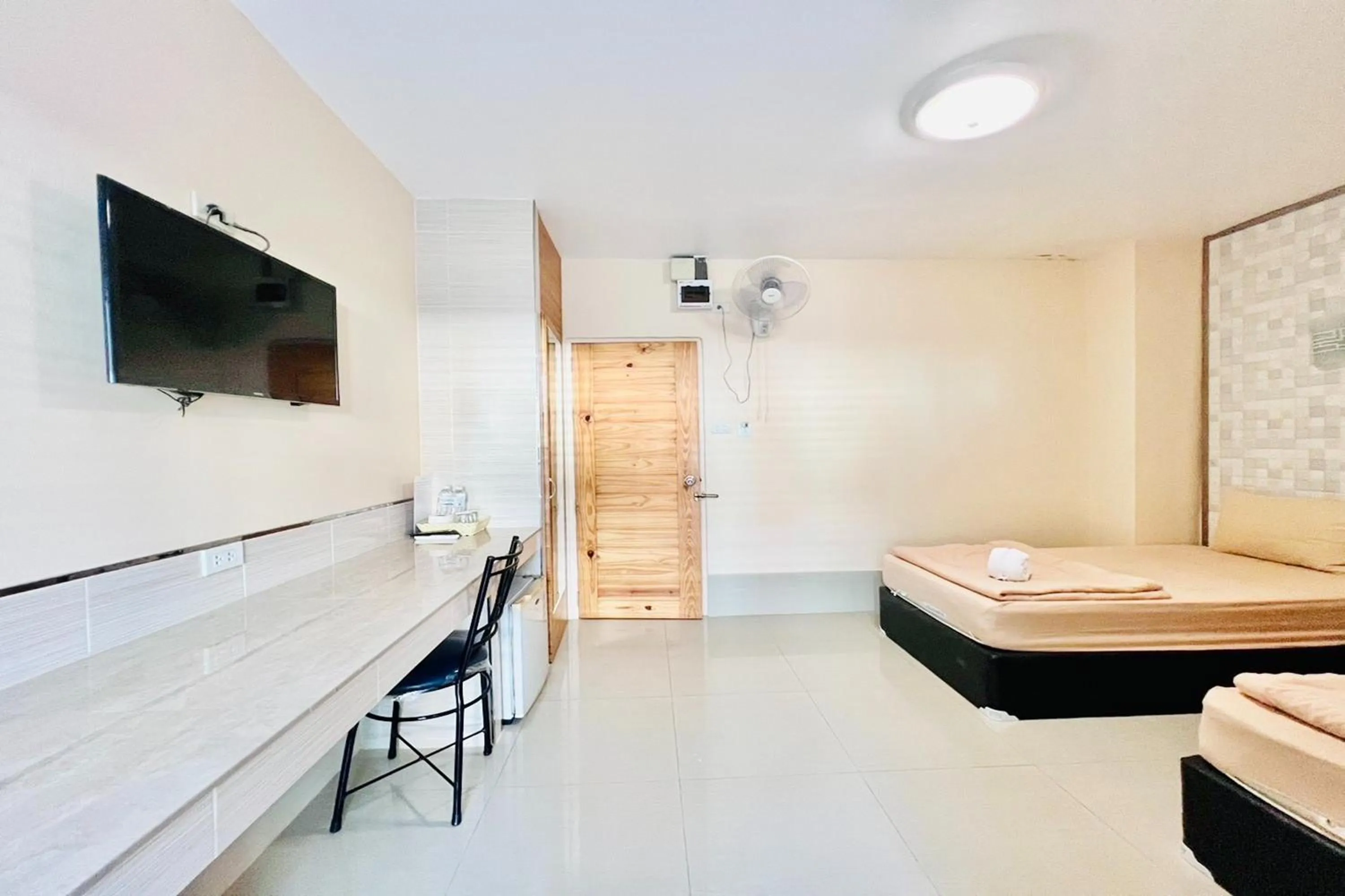 Bed in Veerakit Grand Hotel