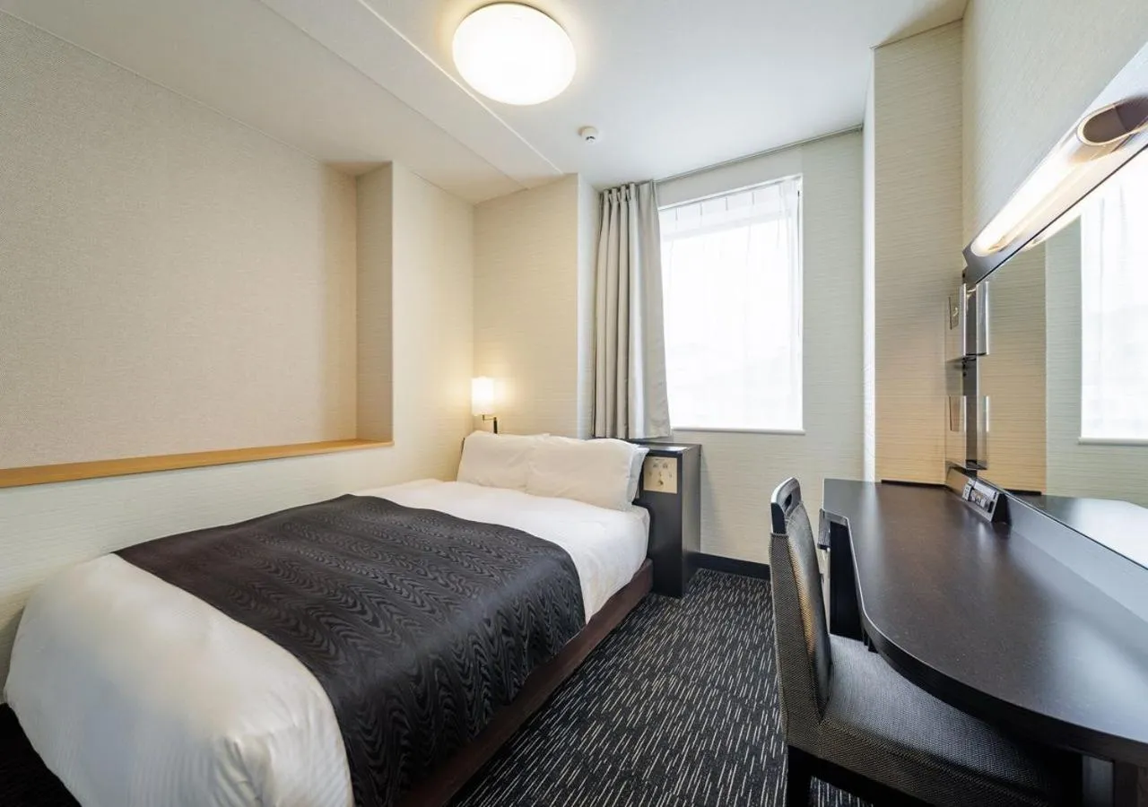 Bed in APA Hotel Miyazaki Nobeoka Chuo
