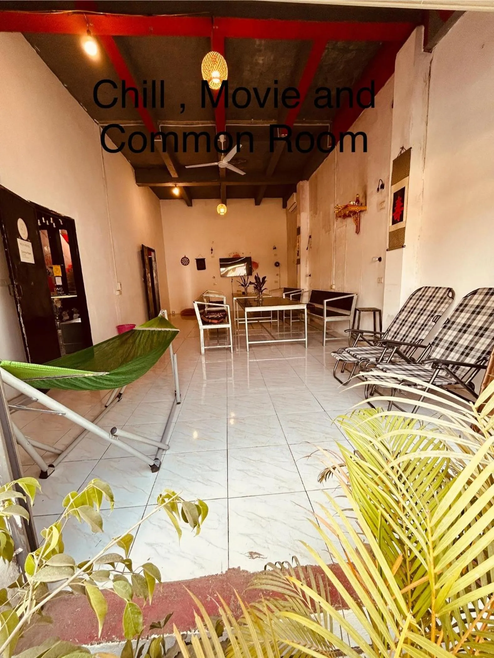 Communal lounge/ TV room in Vangvieng Rock Backpacker Rooftop Hostel