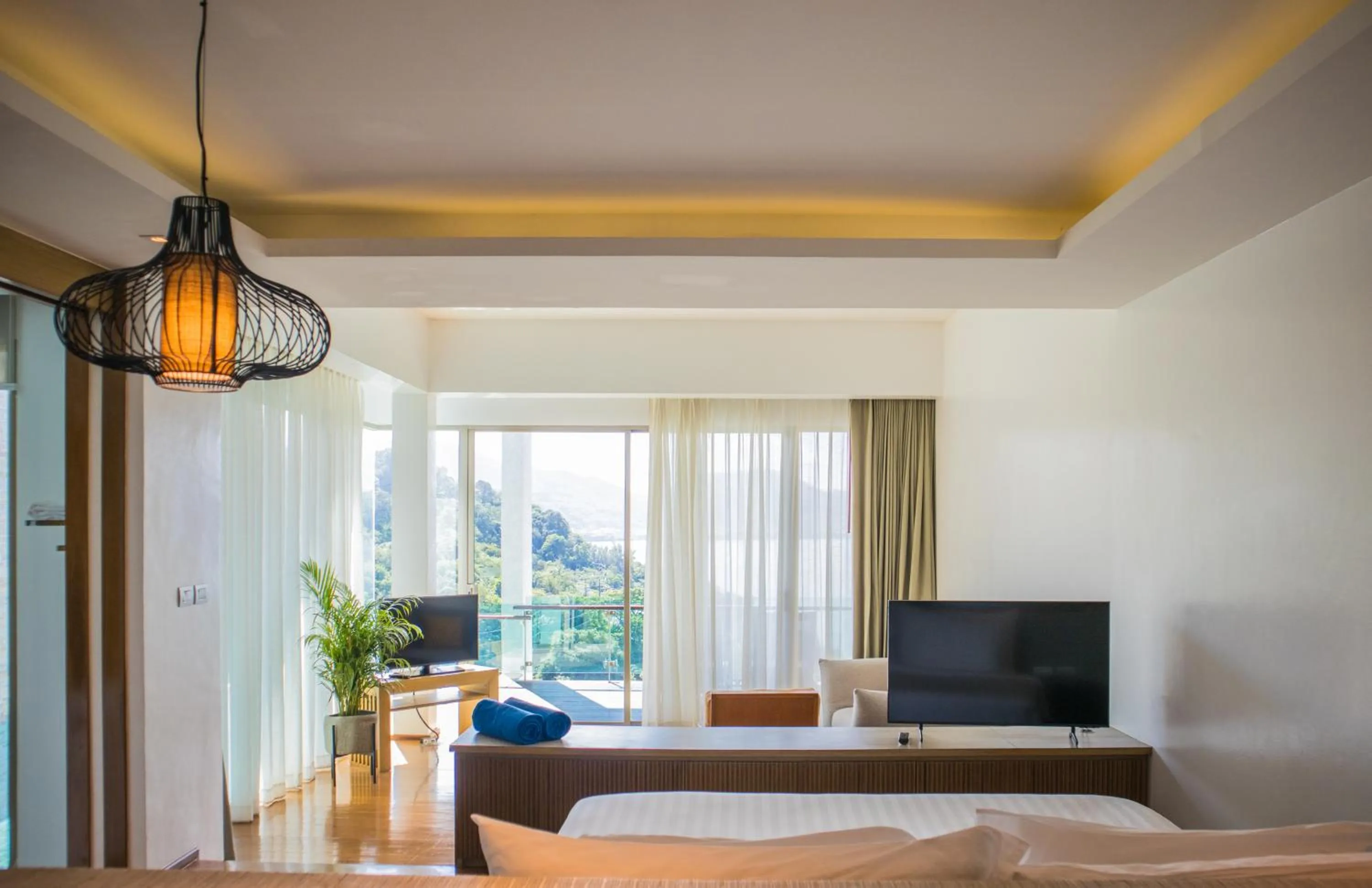 Living room, Bed in Wyndham Grand Phuket Kalim Bay