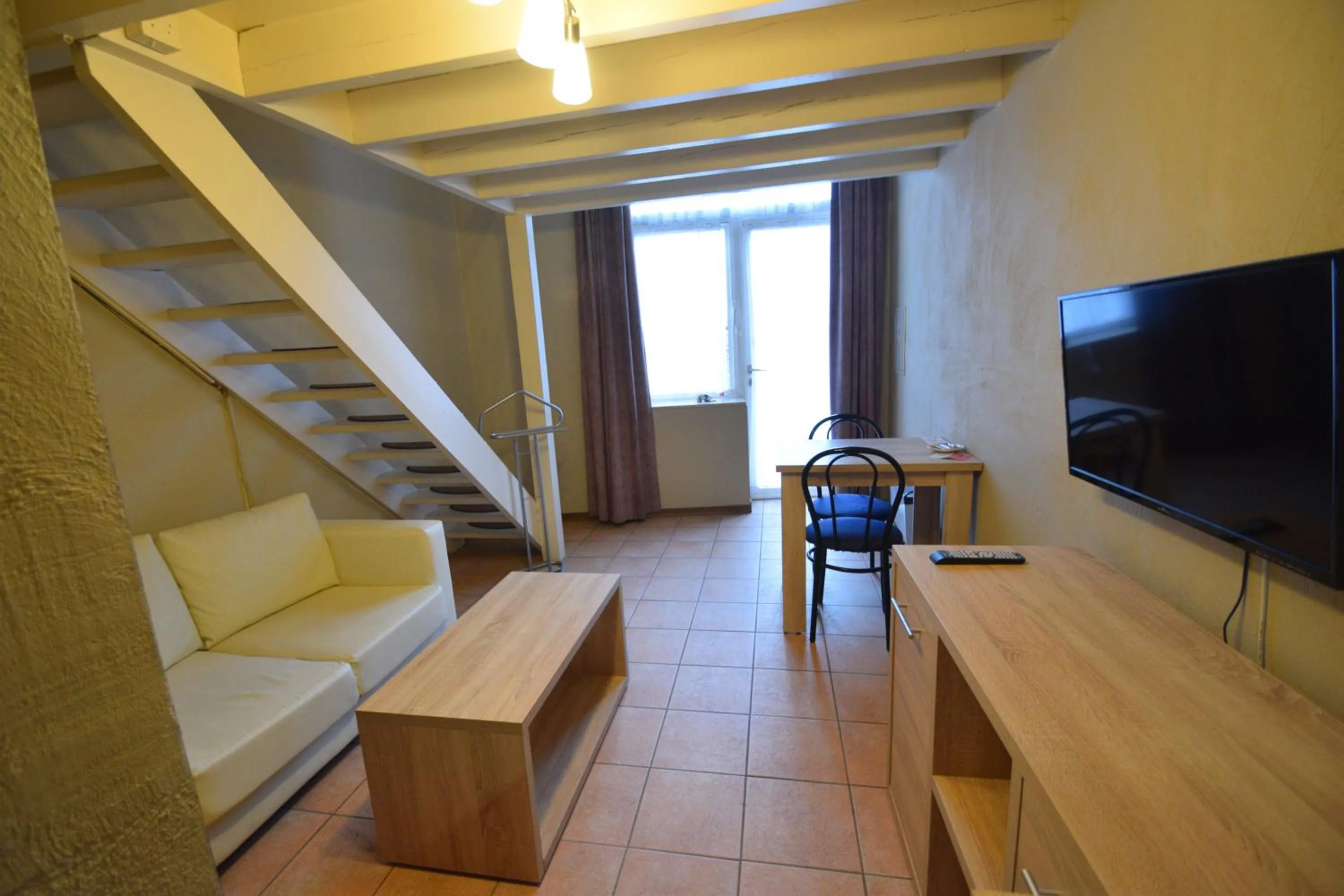 Seating area in Condo Gardens Leuven