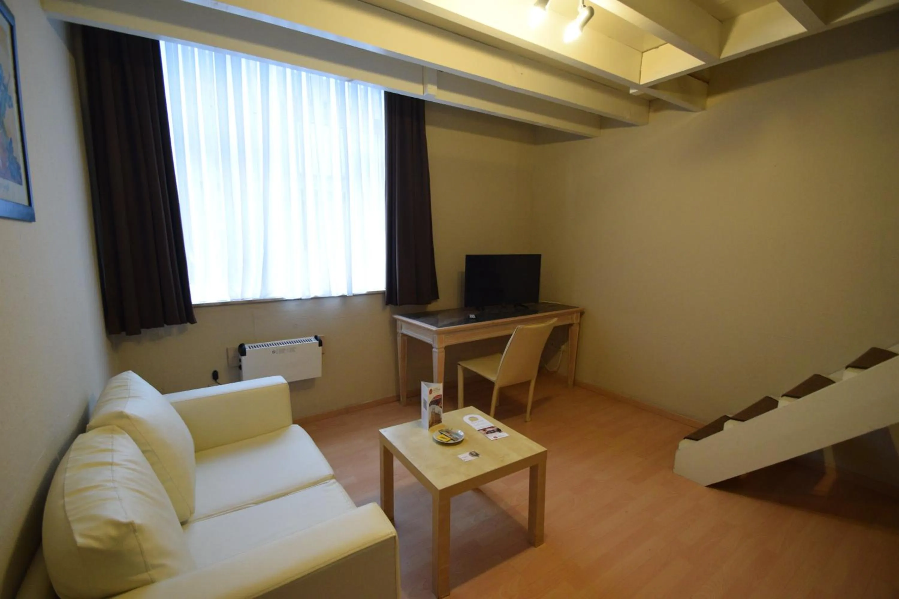 Seating area in Condo Gardens Leuven